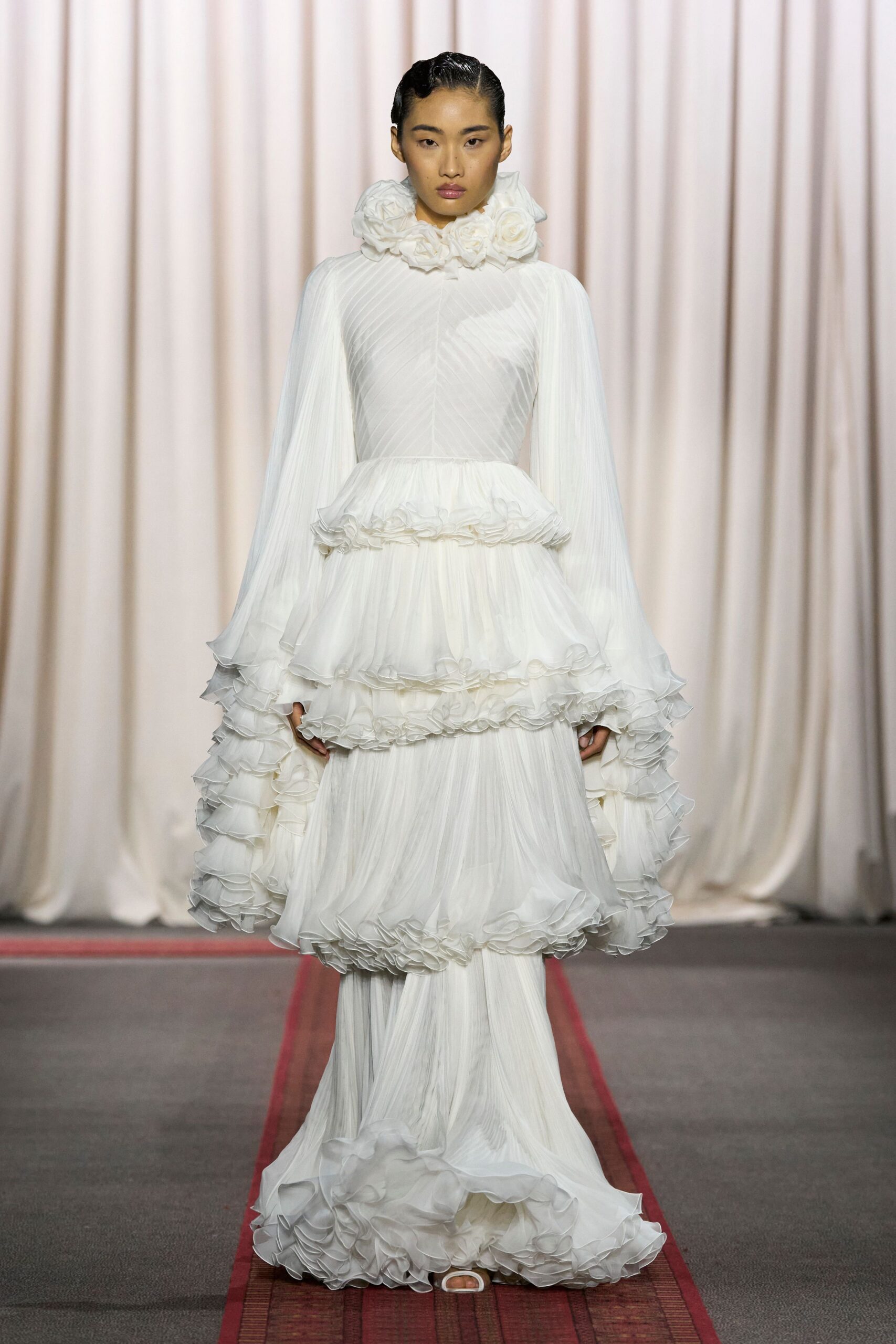white flowing ruffled gown