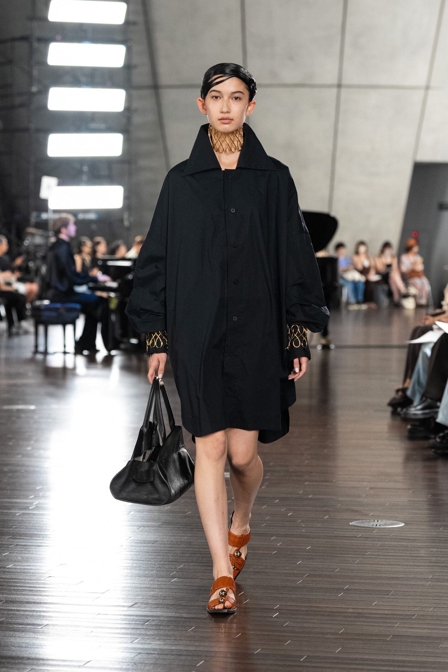 black cotton long-sleeve collared relaxed buttoned short coat