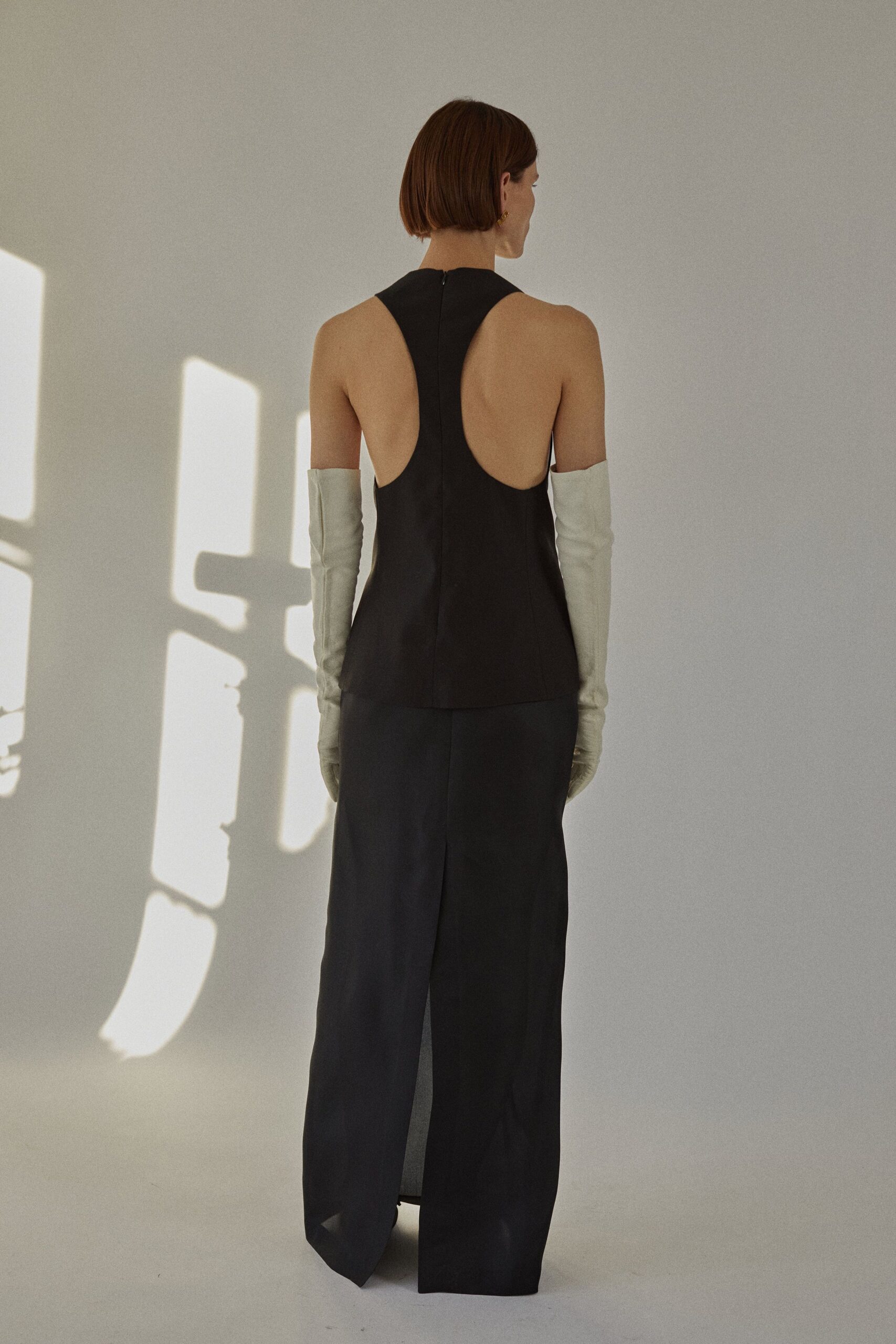black leather sleeveless backless fitted maxi gown