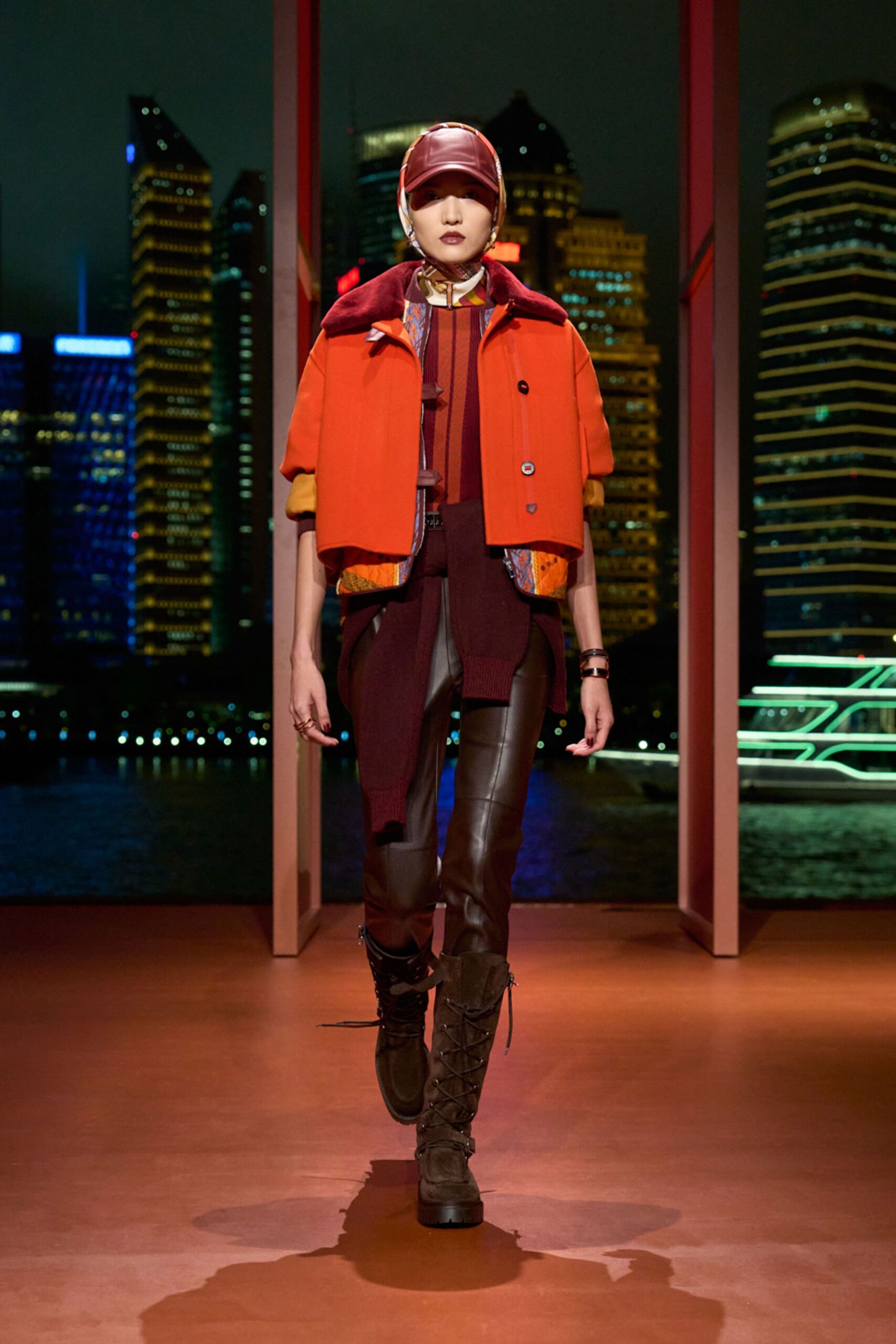 orange jacket red top black pants