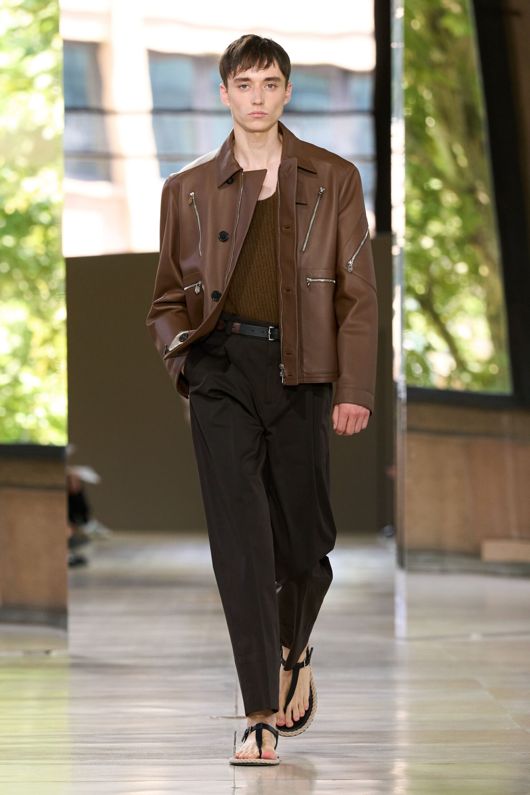 brown leather jacket with black pants