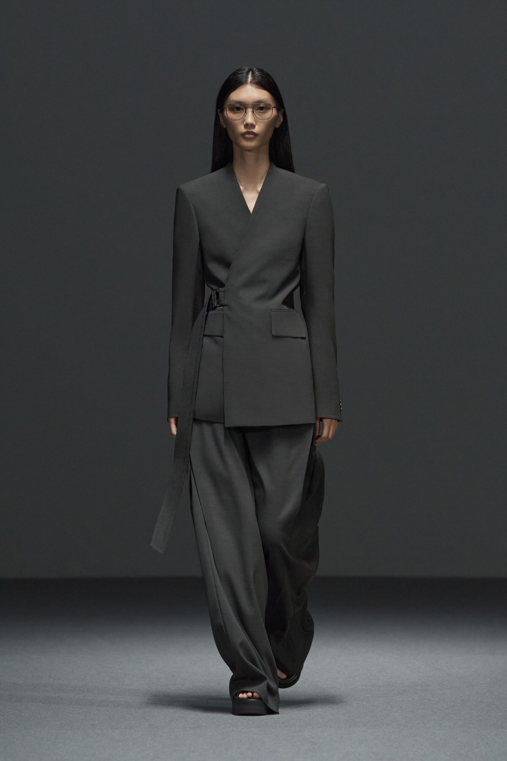 black structured blazer and relaxed pants