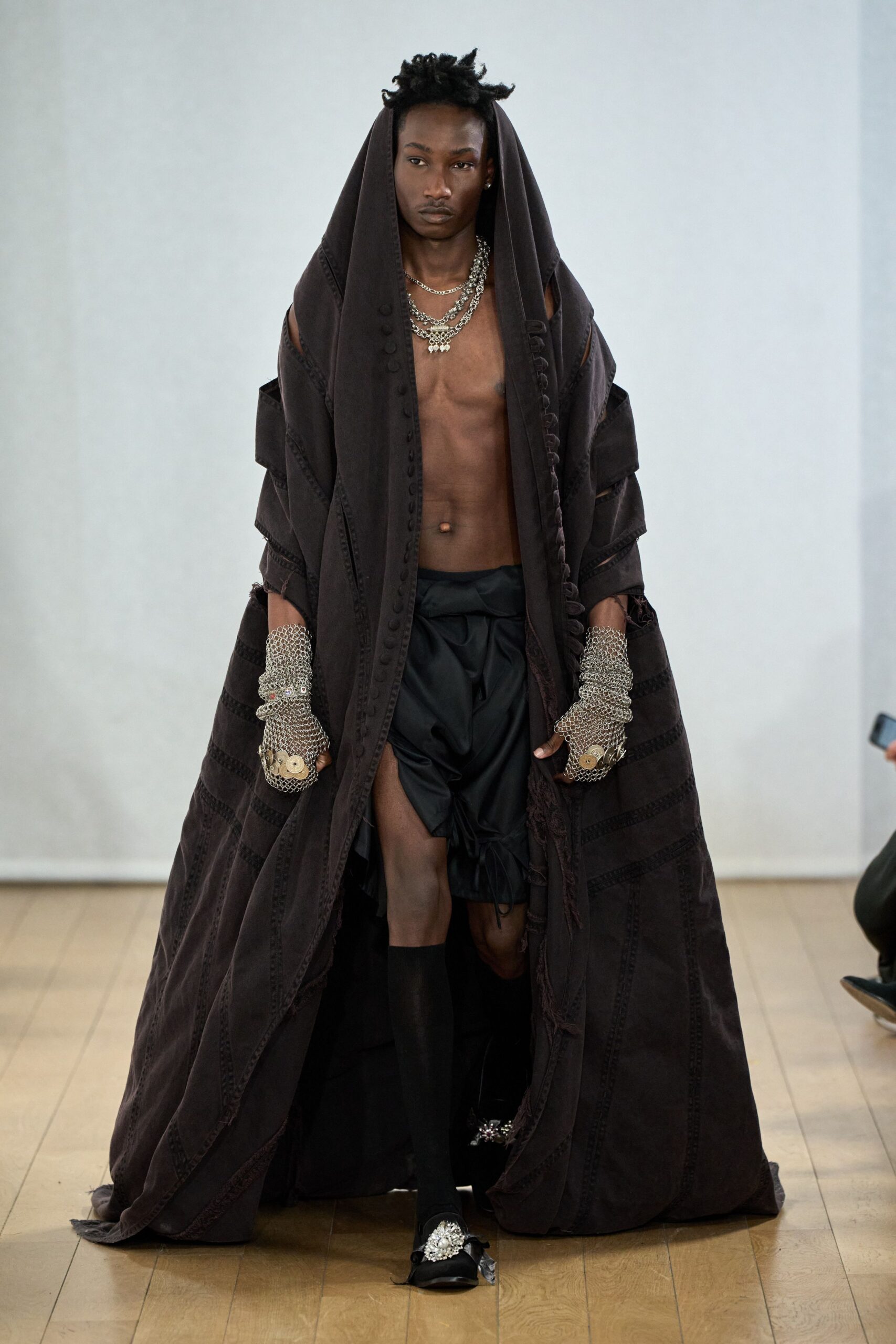 black layered cape with shorts