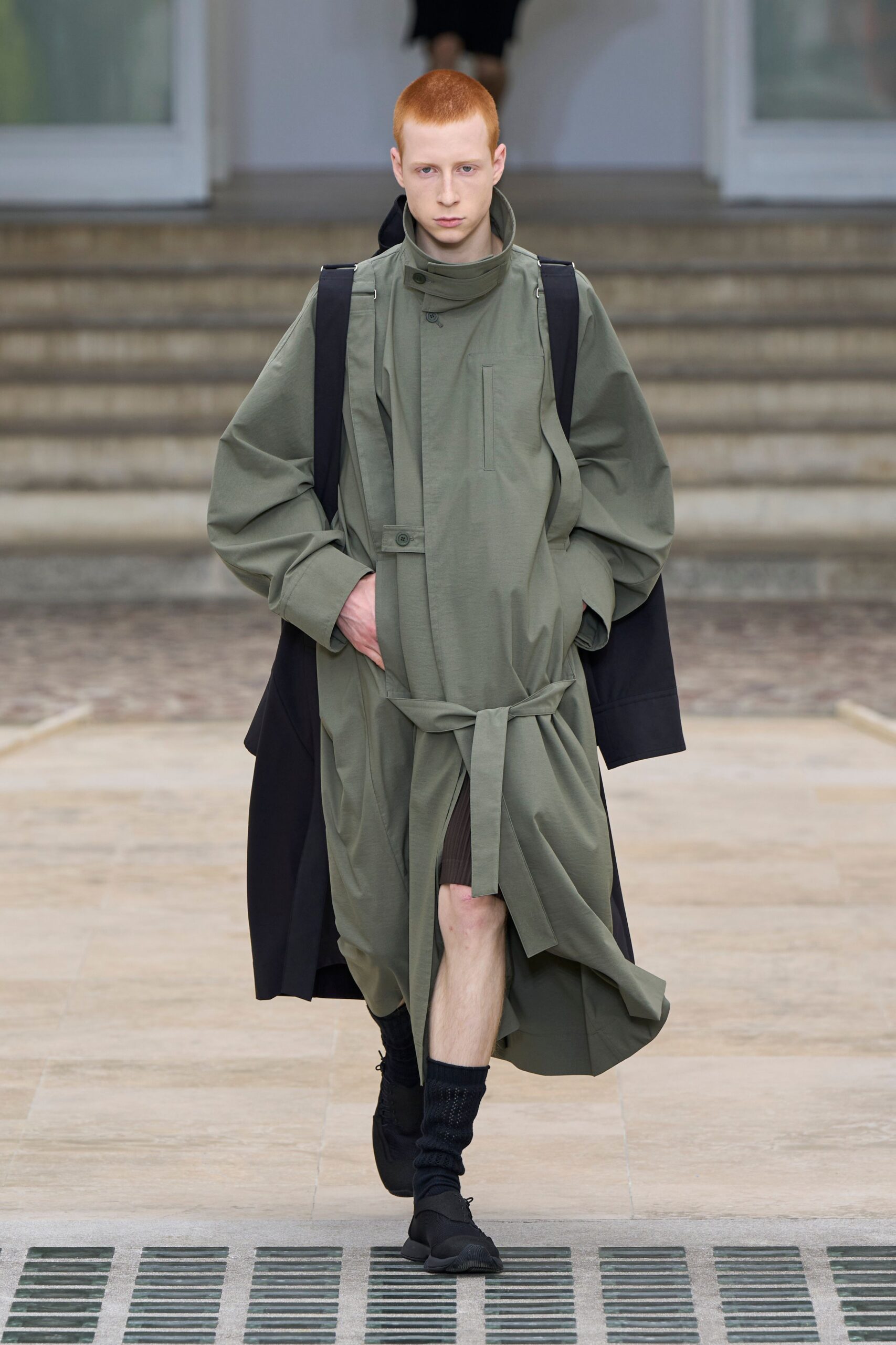 green coat with black shorts