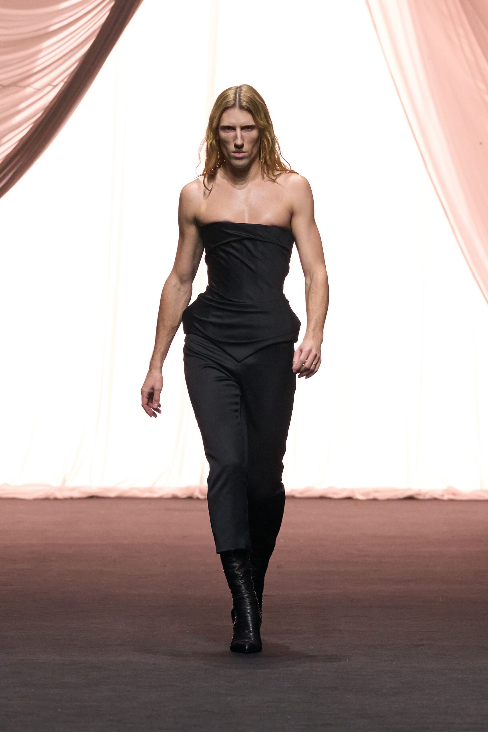 black fitted strapless jumpsuit with boots