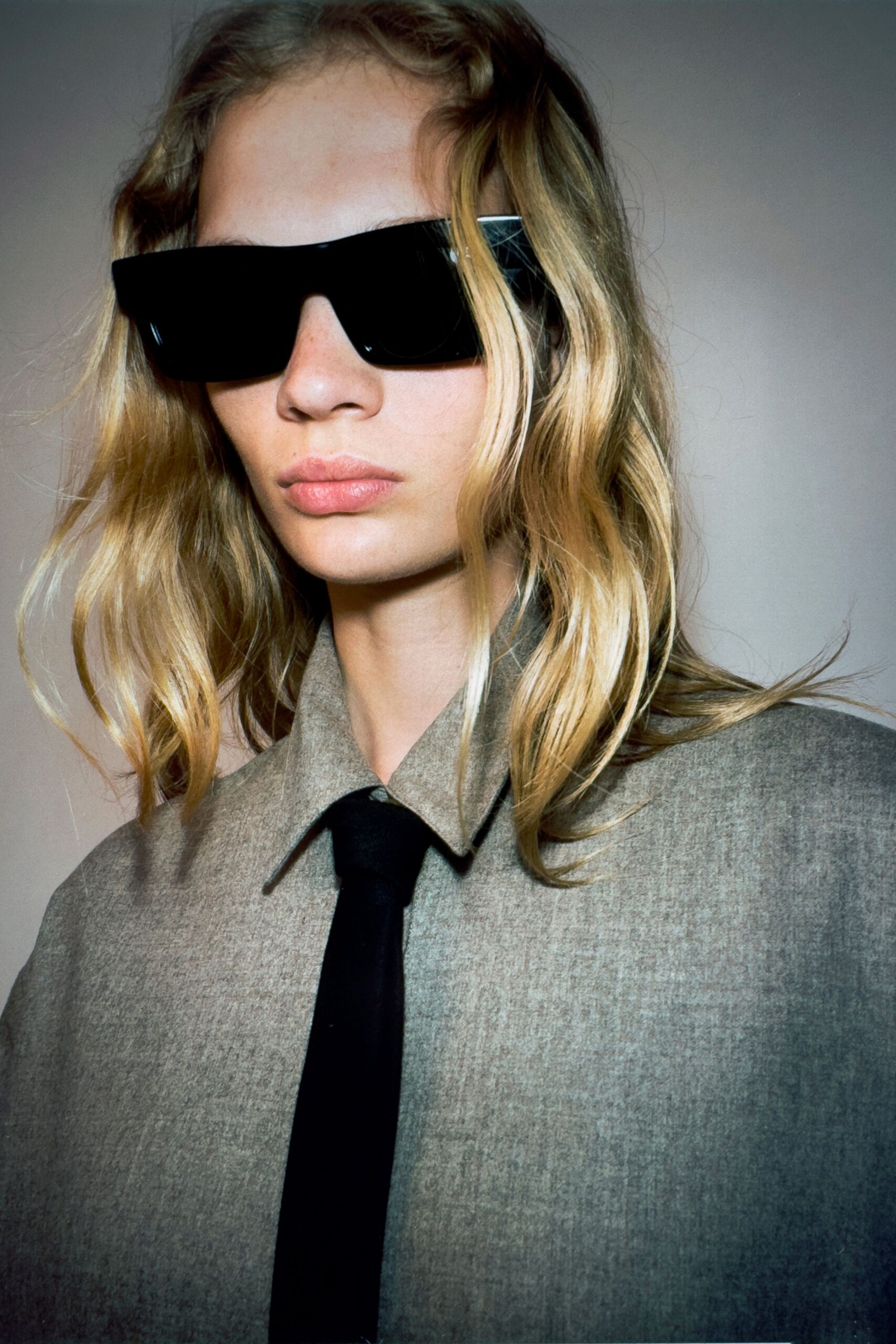 gray relaxed shirt with black tie