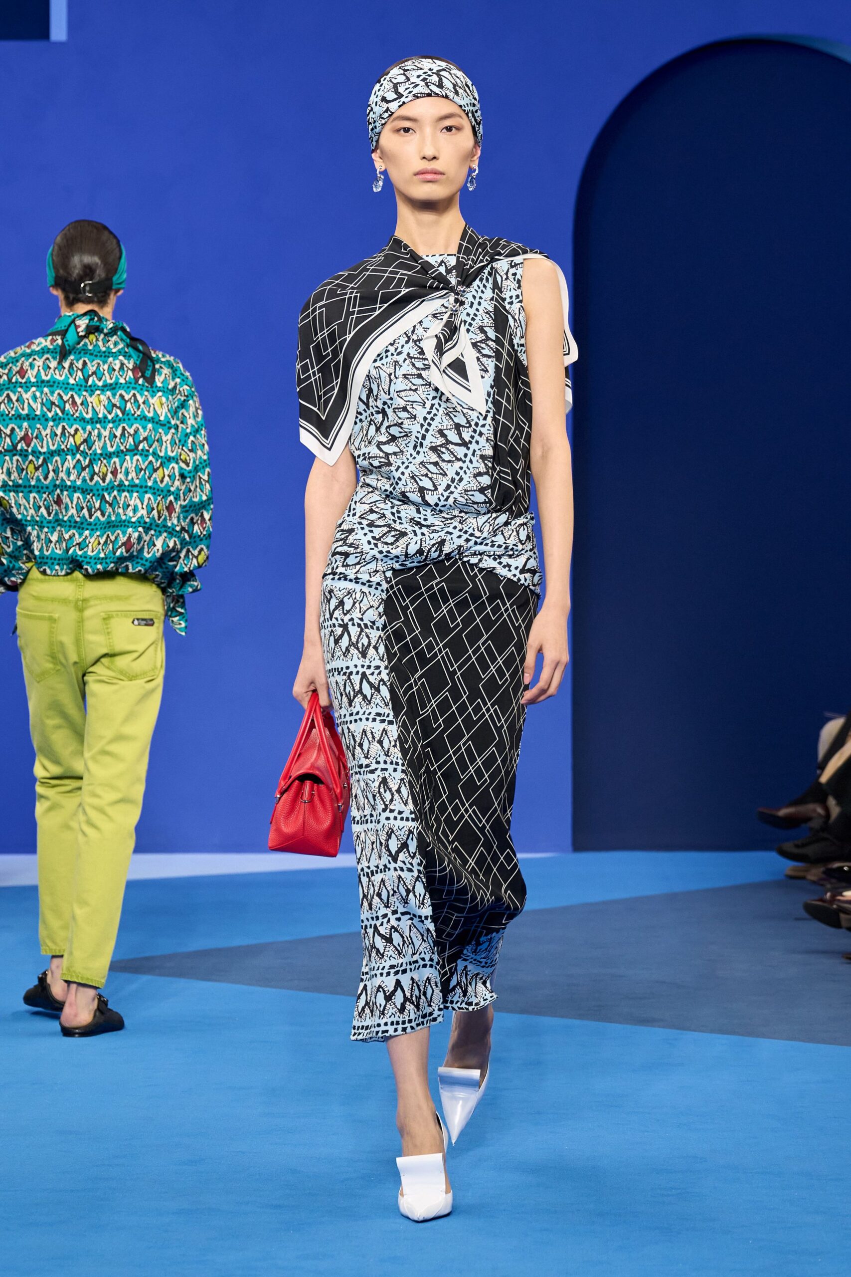 printed midi dress with red bag