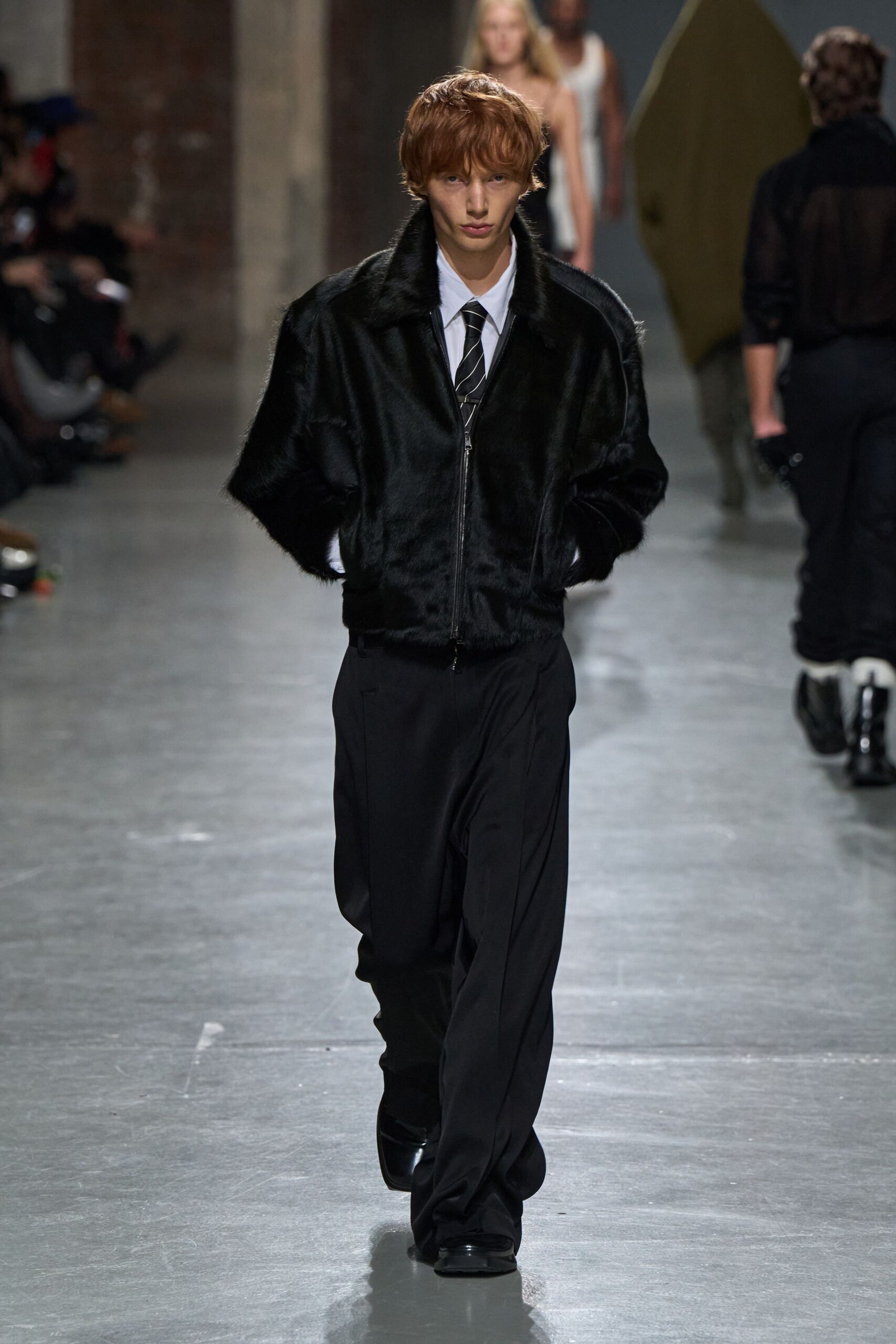 black faux-fur jacket with relaxed pants