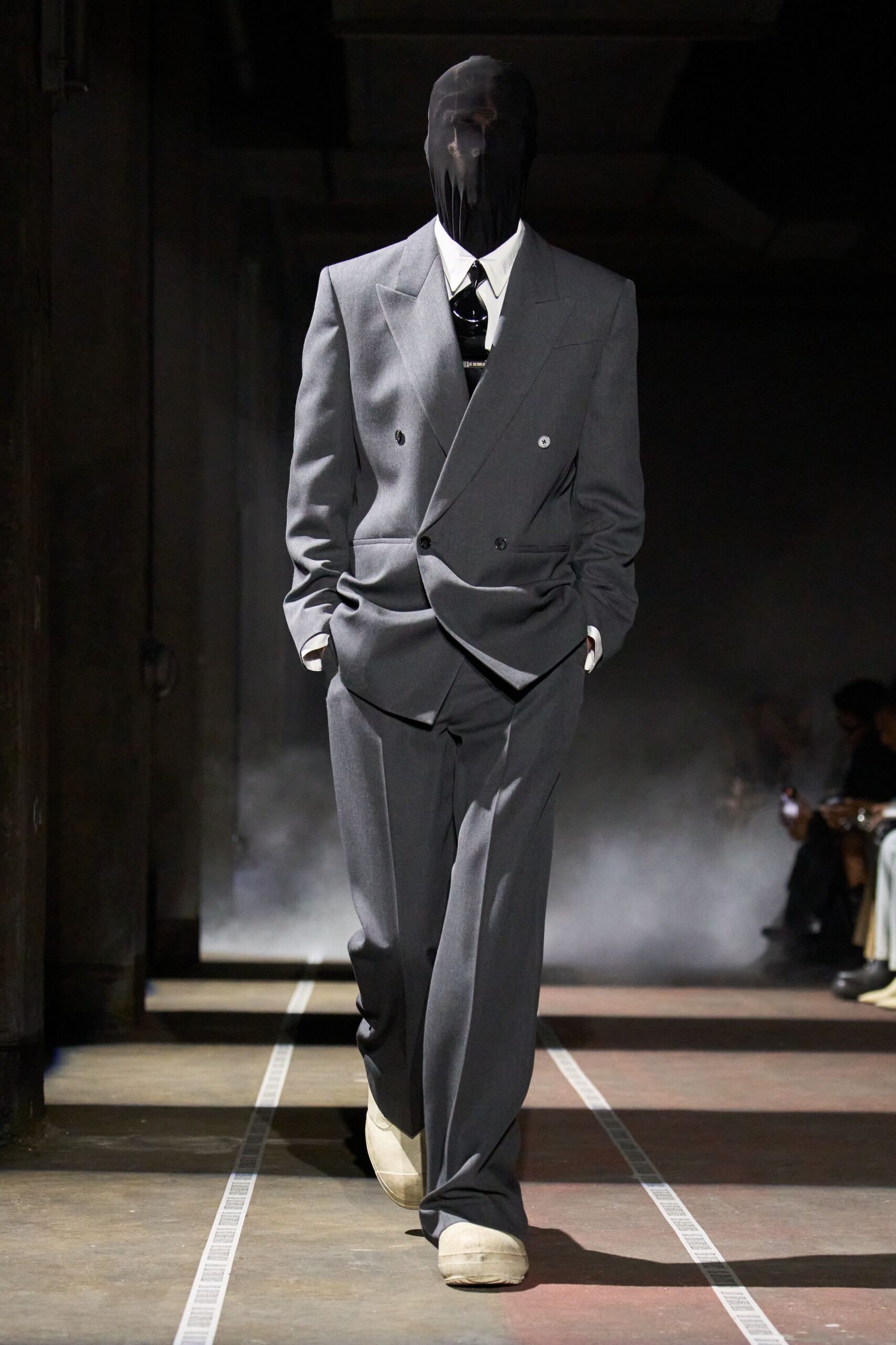 gray tailored suit with white shoes