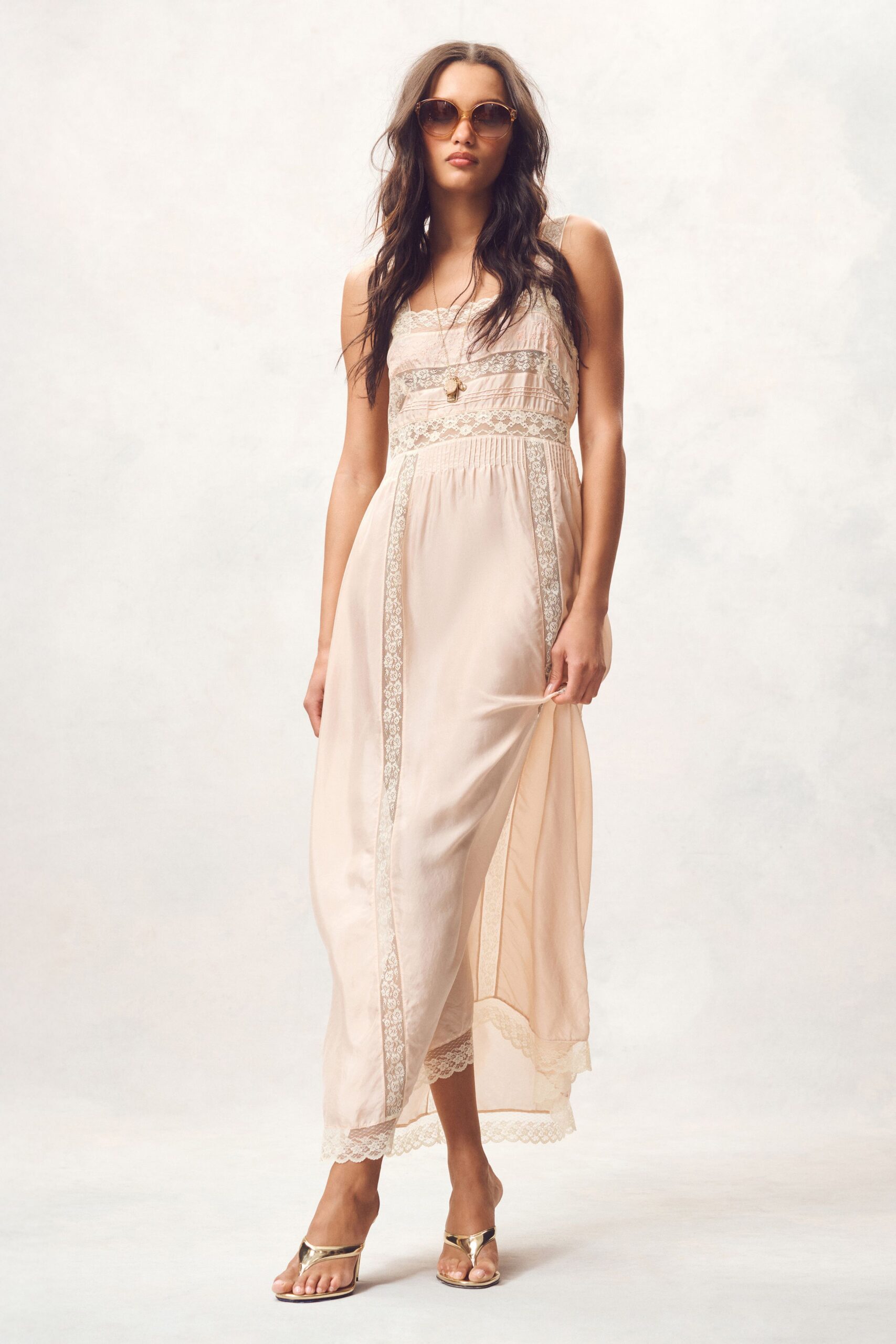 beige silk sleeveless v-neck fitted embroidered layered gown