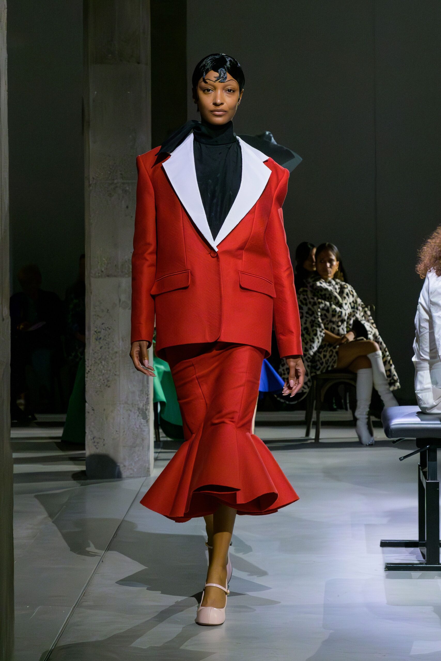 red long-sleeve collared fitted buttoned flared suit