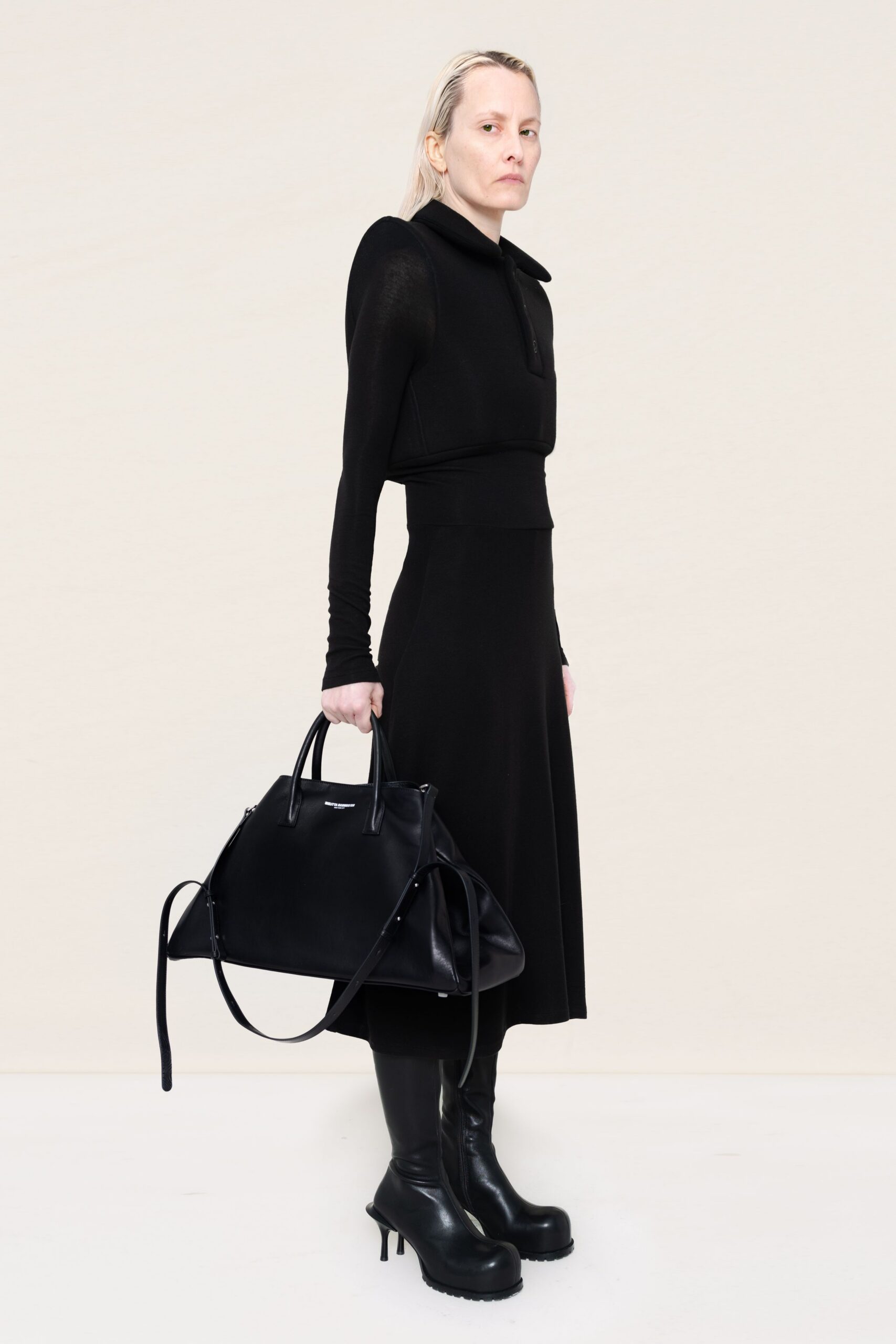 black fitted midi dress with boots