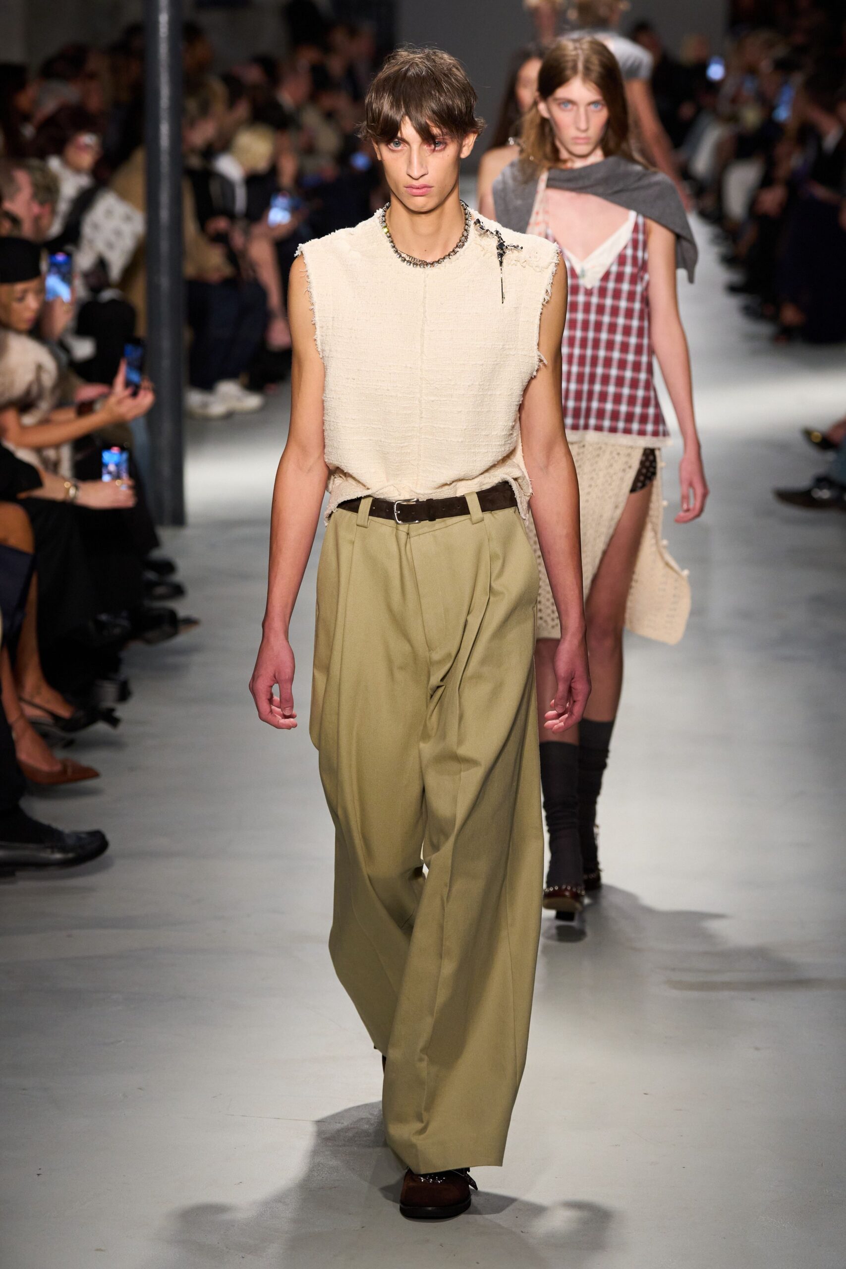 beige sleeveless top with khaki pants