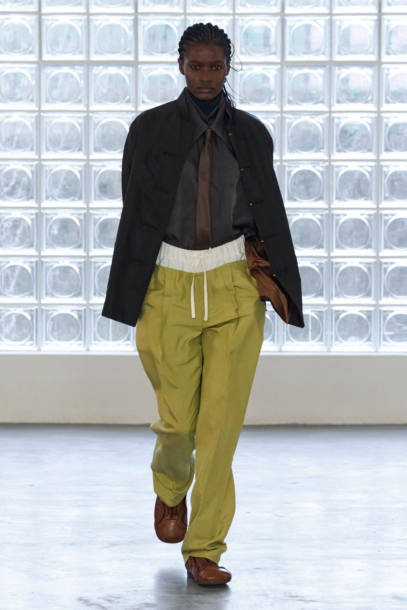 black jacket gray shirt green pants