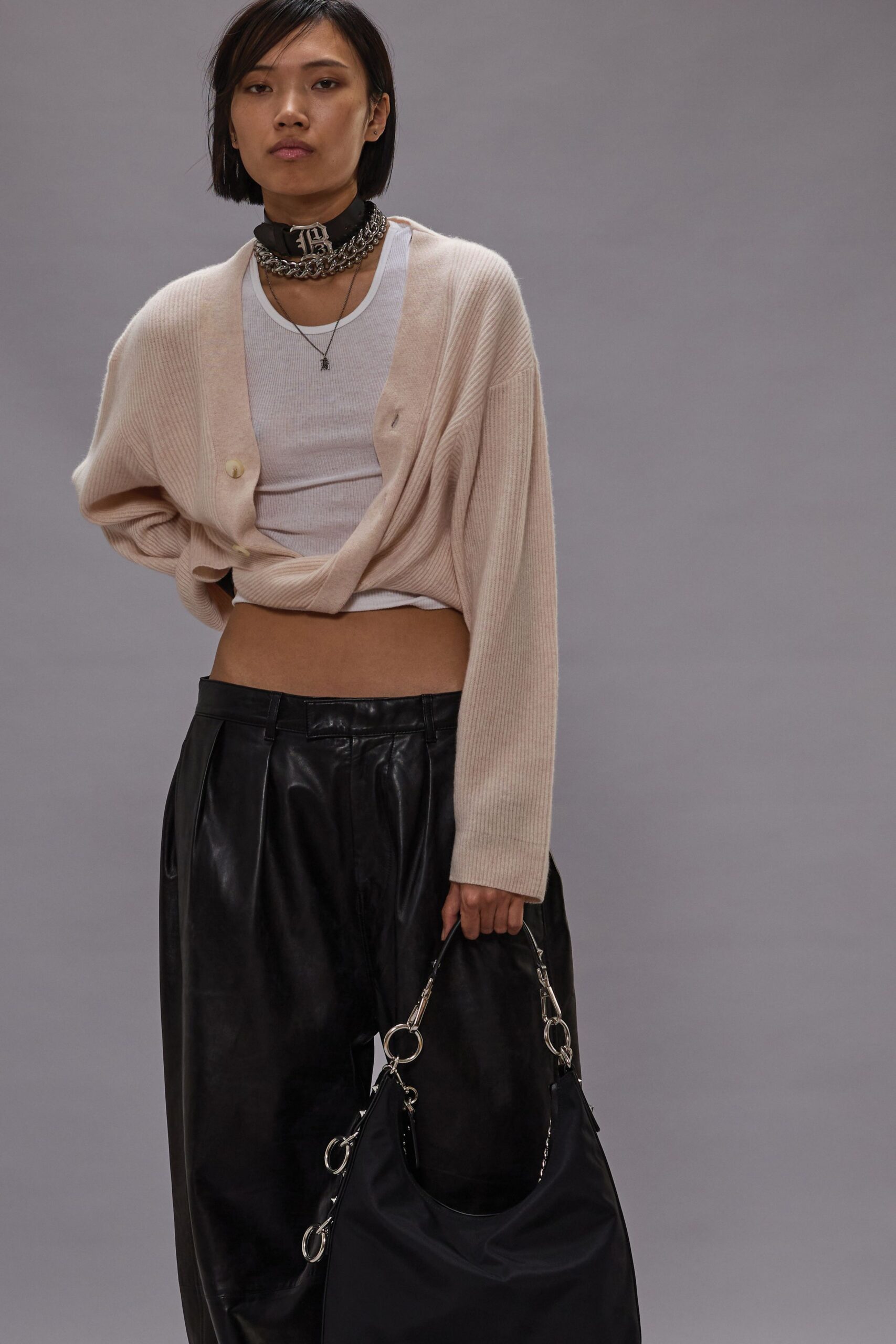 beige cardigan white tank-top black pants