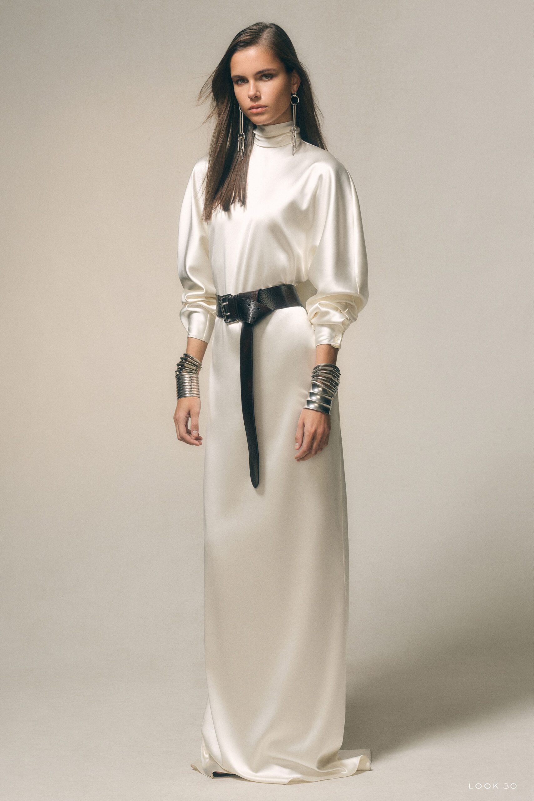 white silk long-sleeve high-neck fitted belted shiny gown