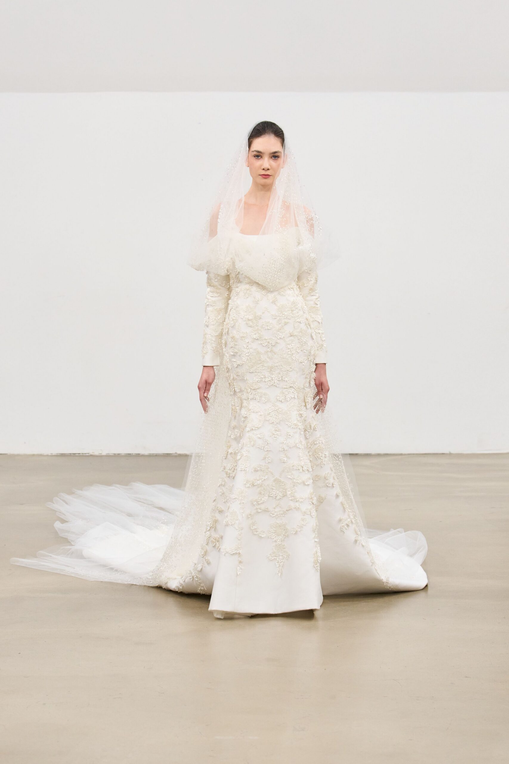 white silk fitted gown with veil