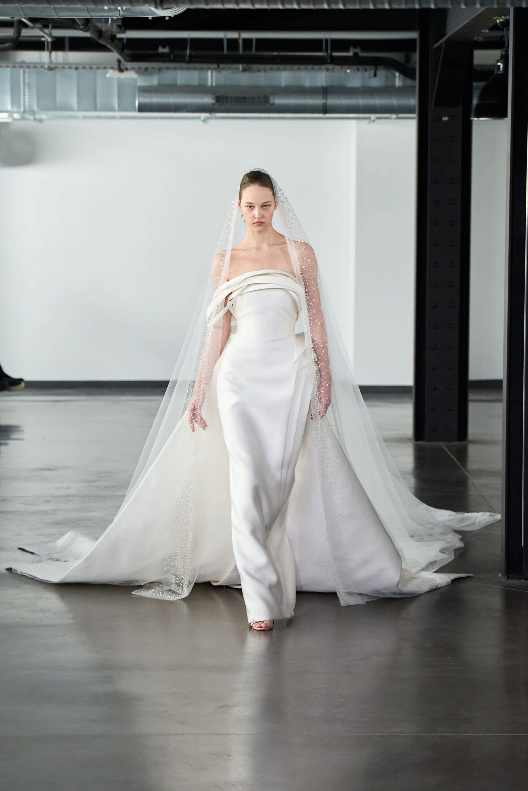 white silk strapless fitted draped flowing maxi gown