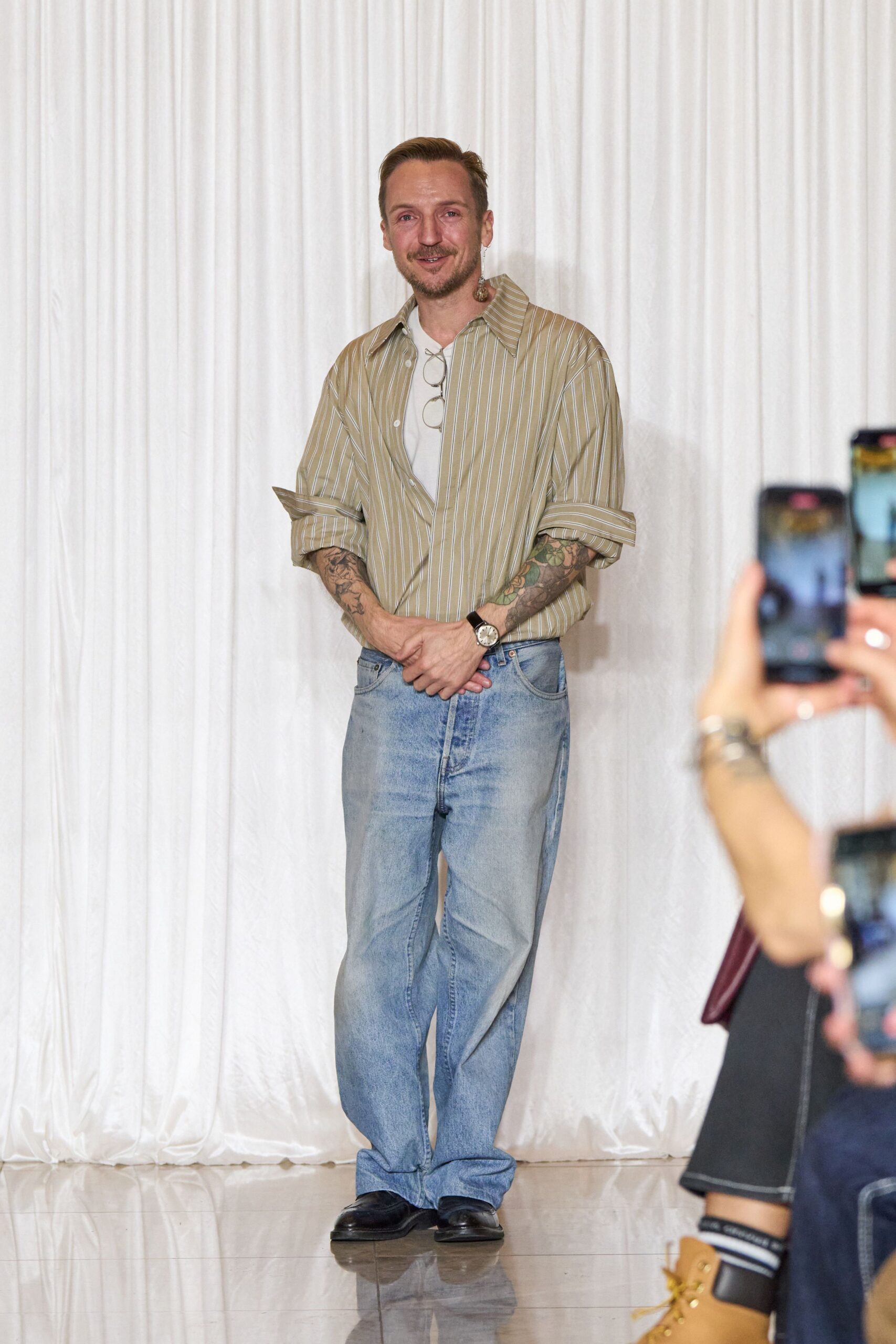 beige striped shirt with blue jeans