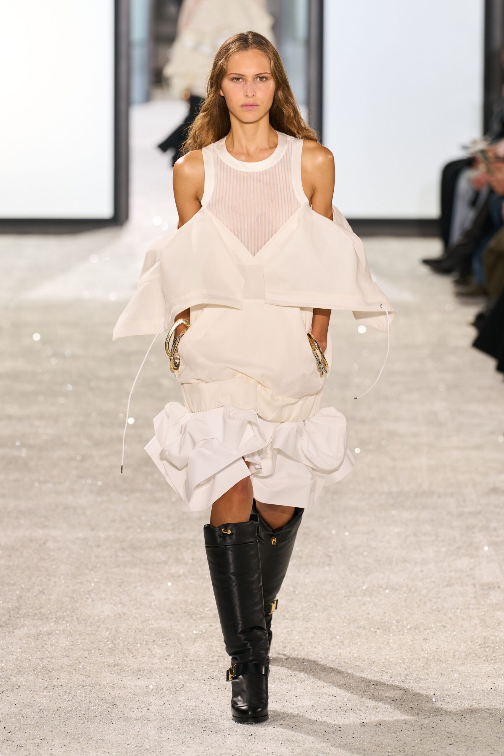 white pleated mini dress with black boots