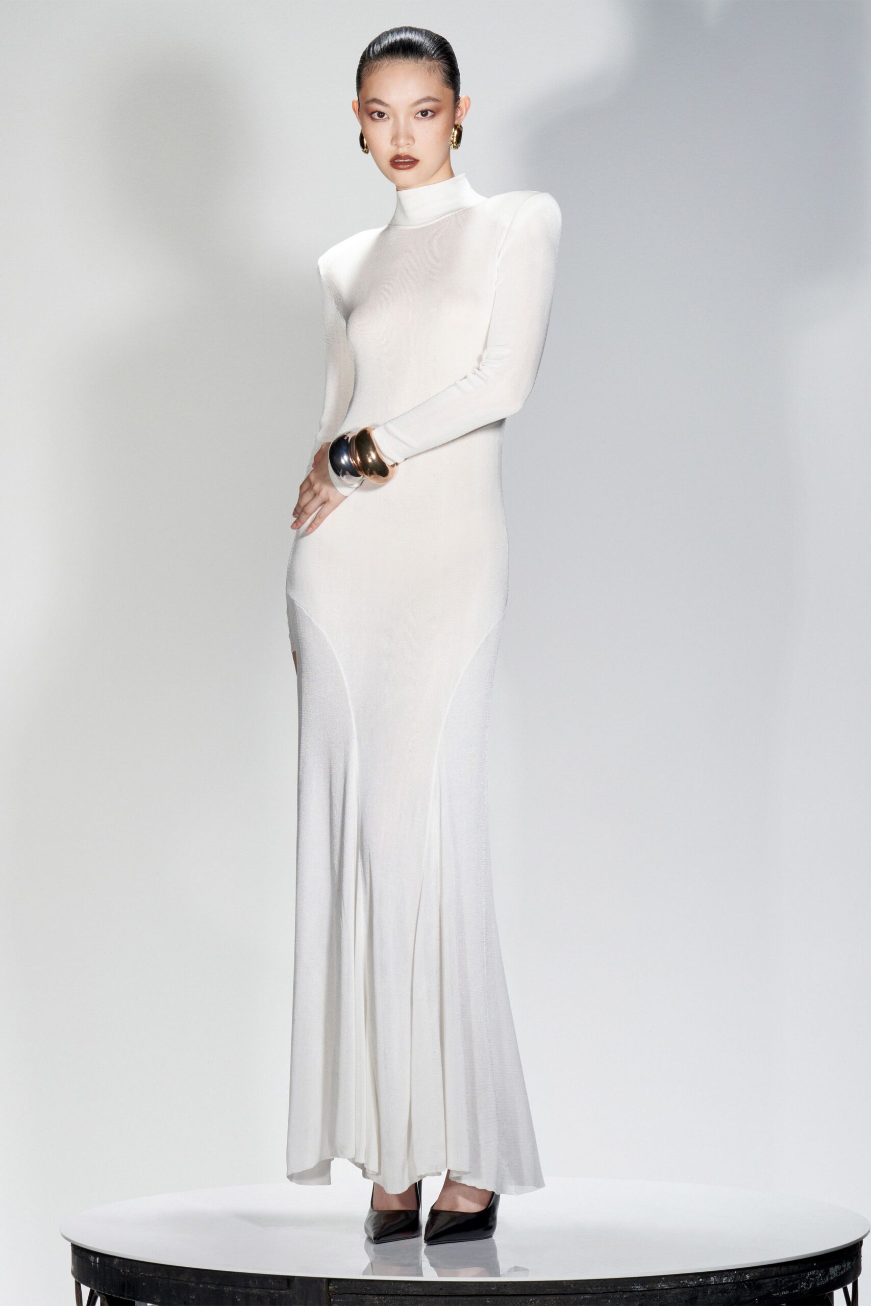 white silk long-sleeve high-neck fitted flared flowing gown