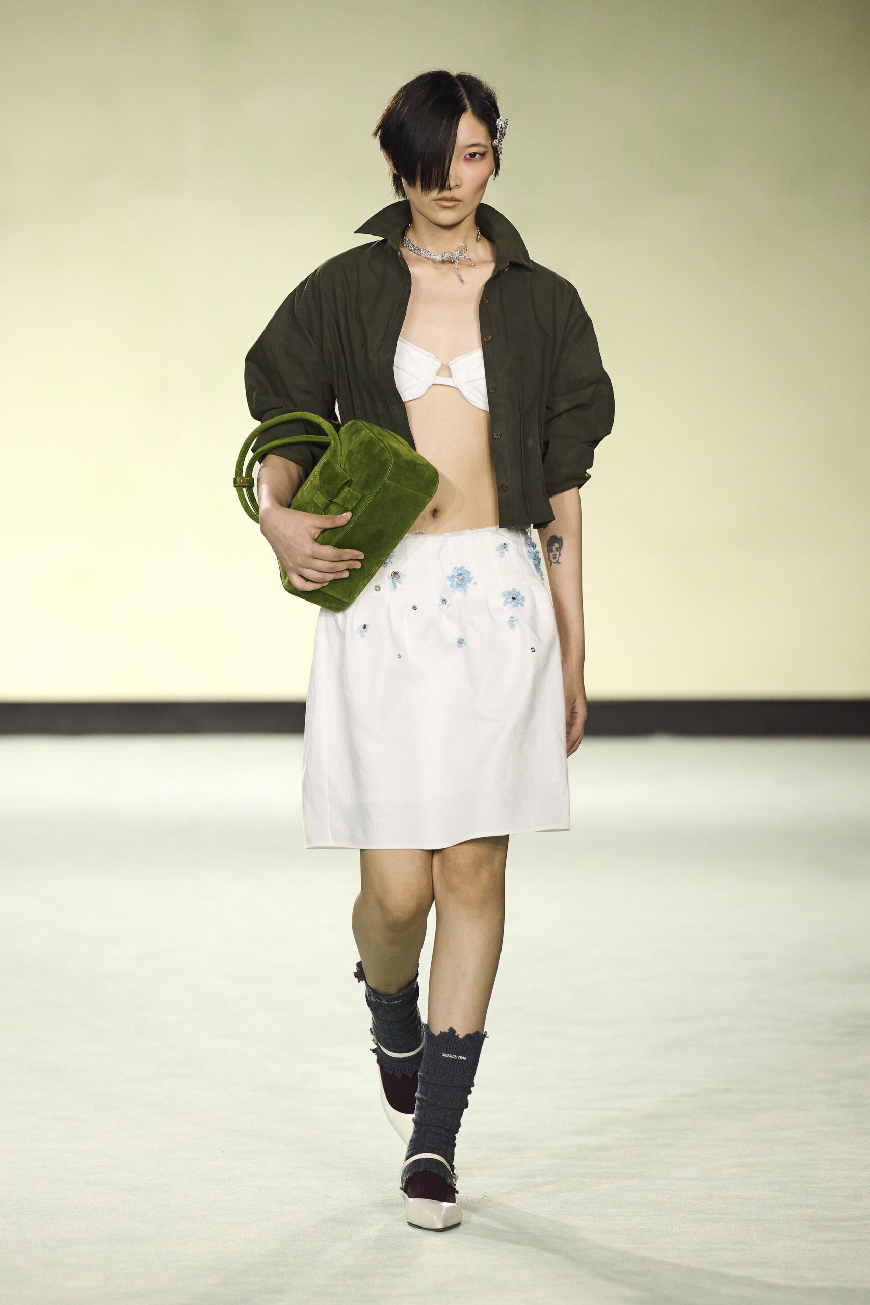 green shirt white skirt outfit