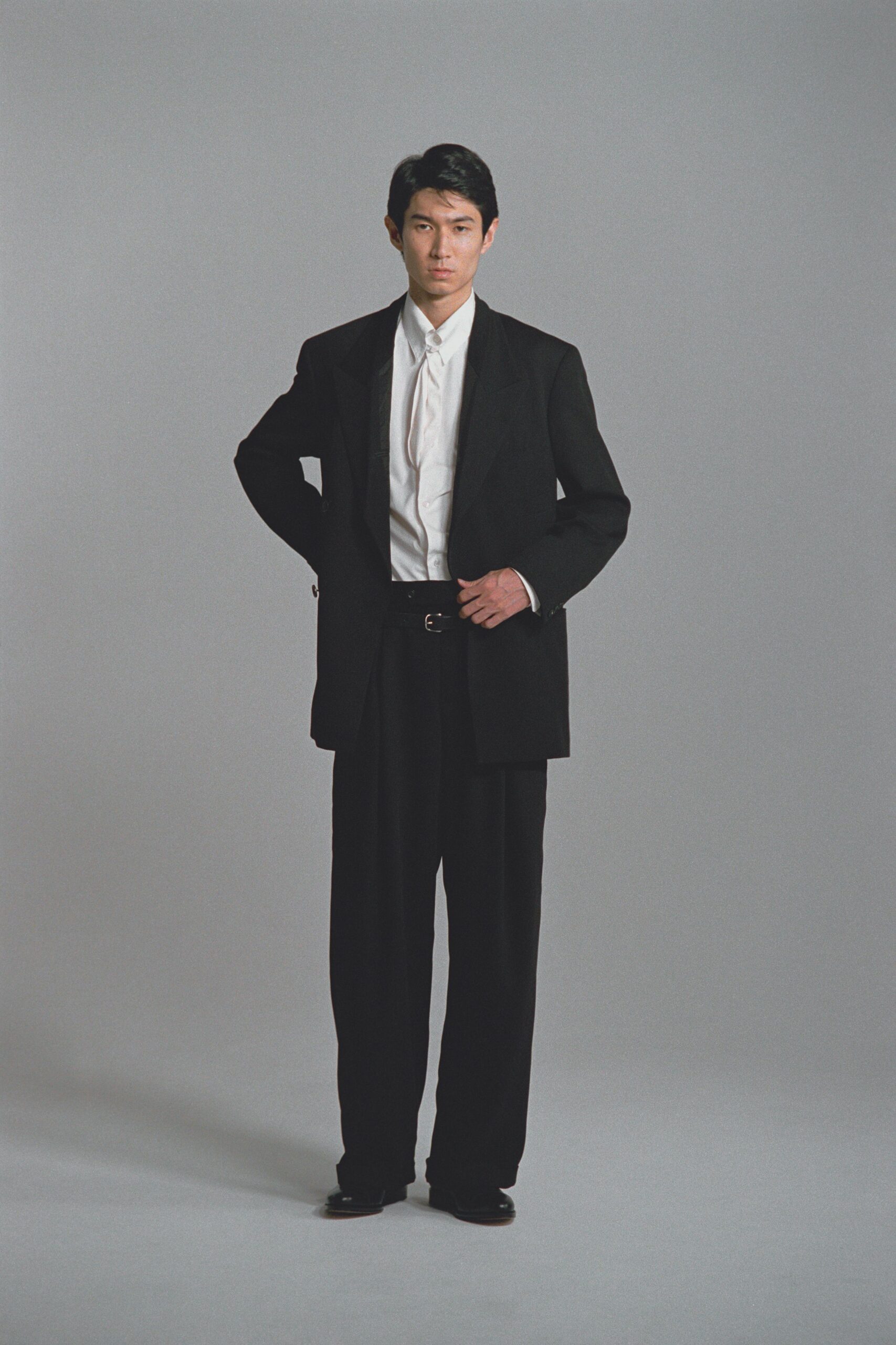 black tailored suit with white shirt
