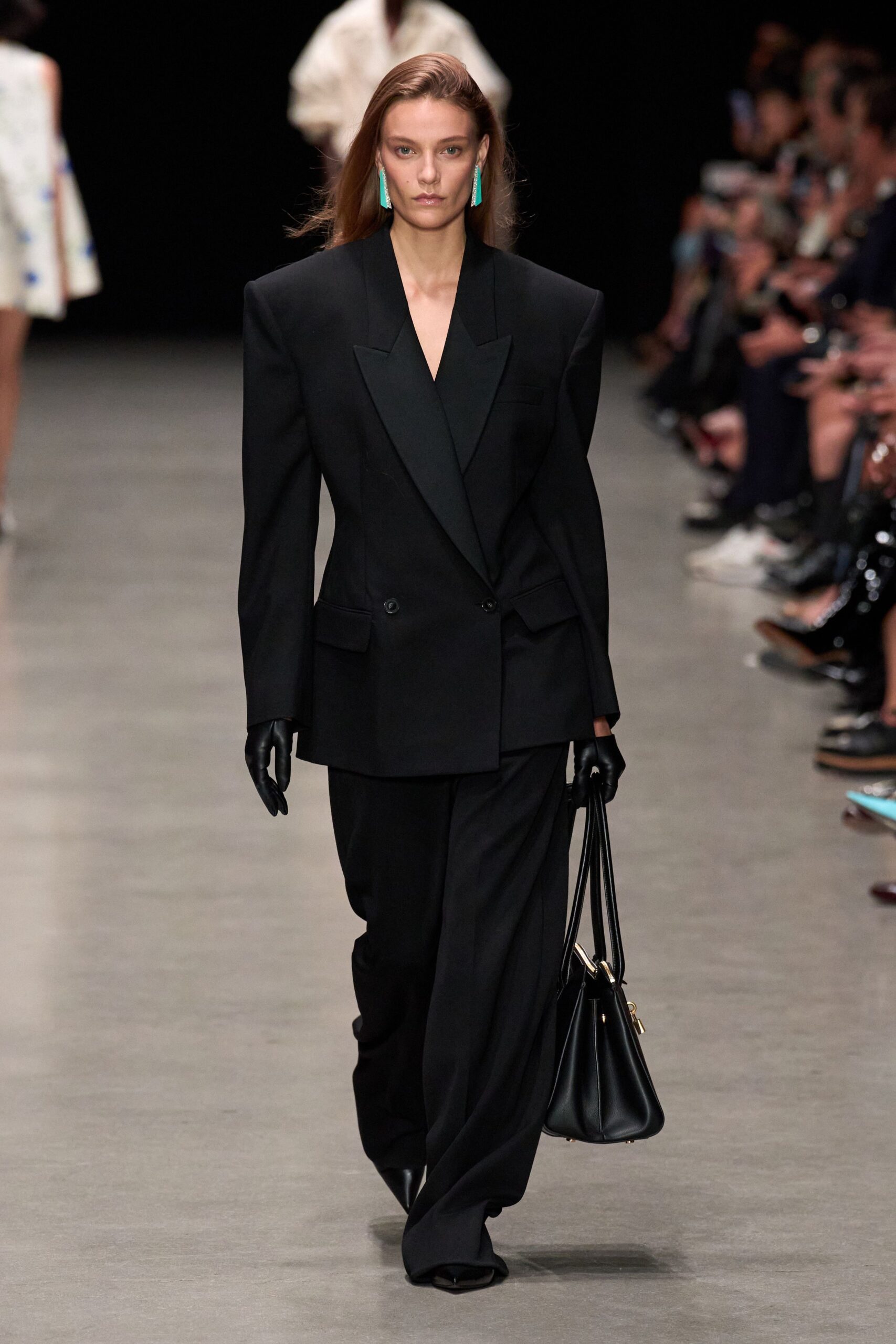 black tailored suit with gloves