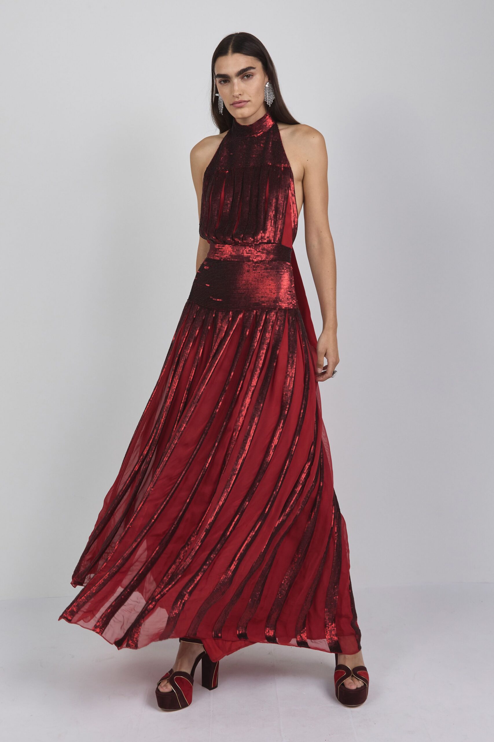 red silk sleeveless high-neck fitted pleated embellished gown