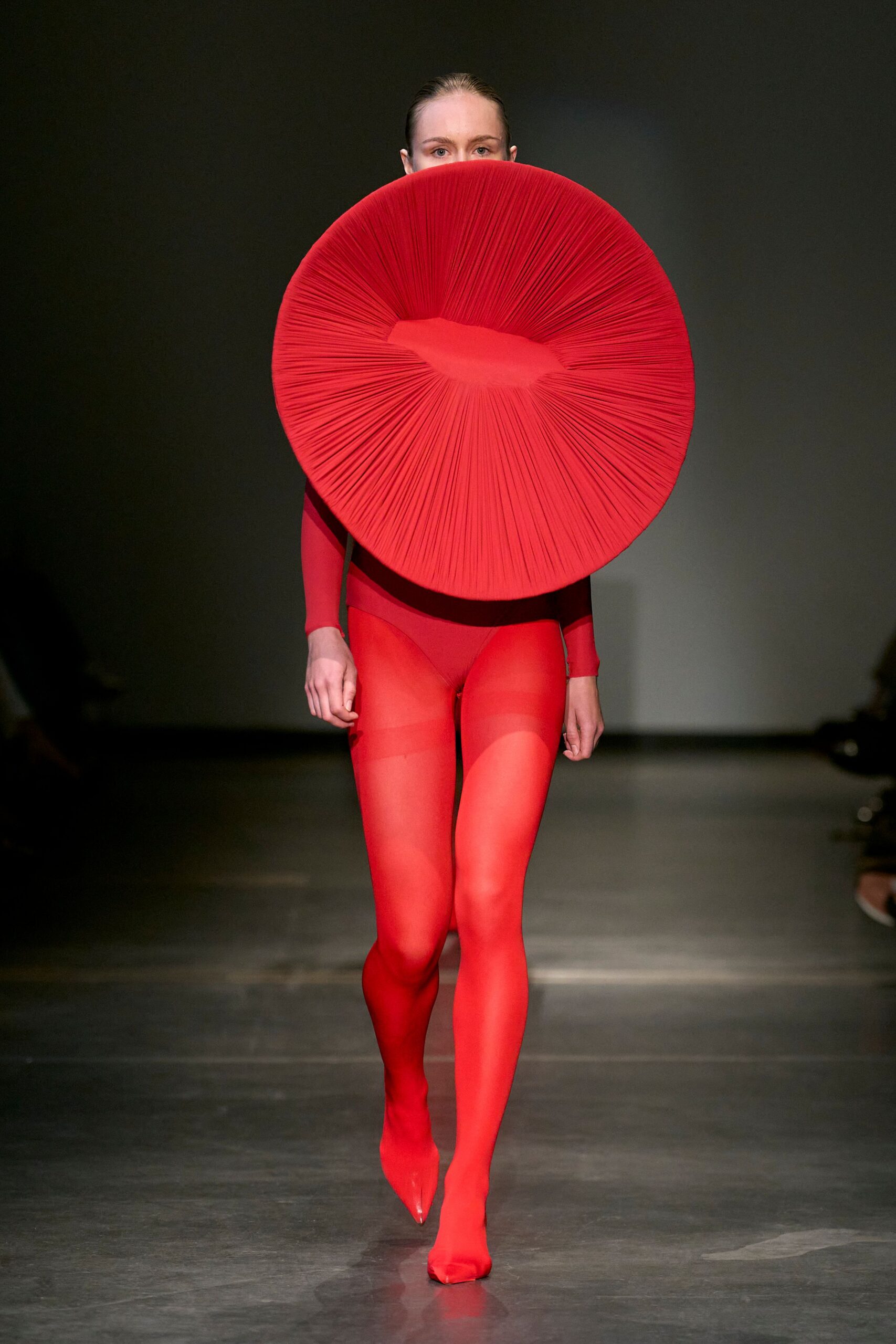 red pleated bodysuit and skirt