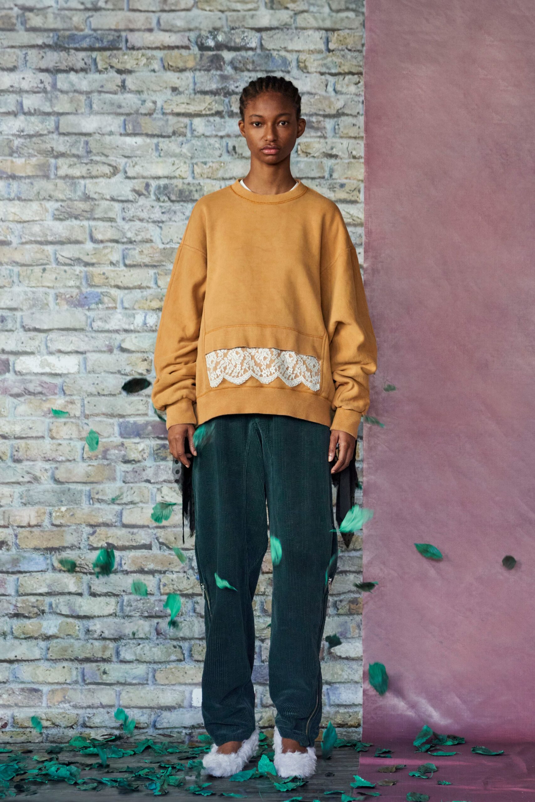 brown relaxed sweater with green pants