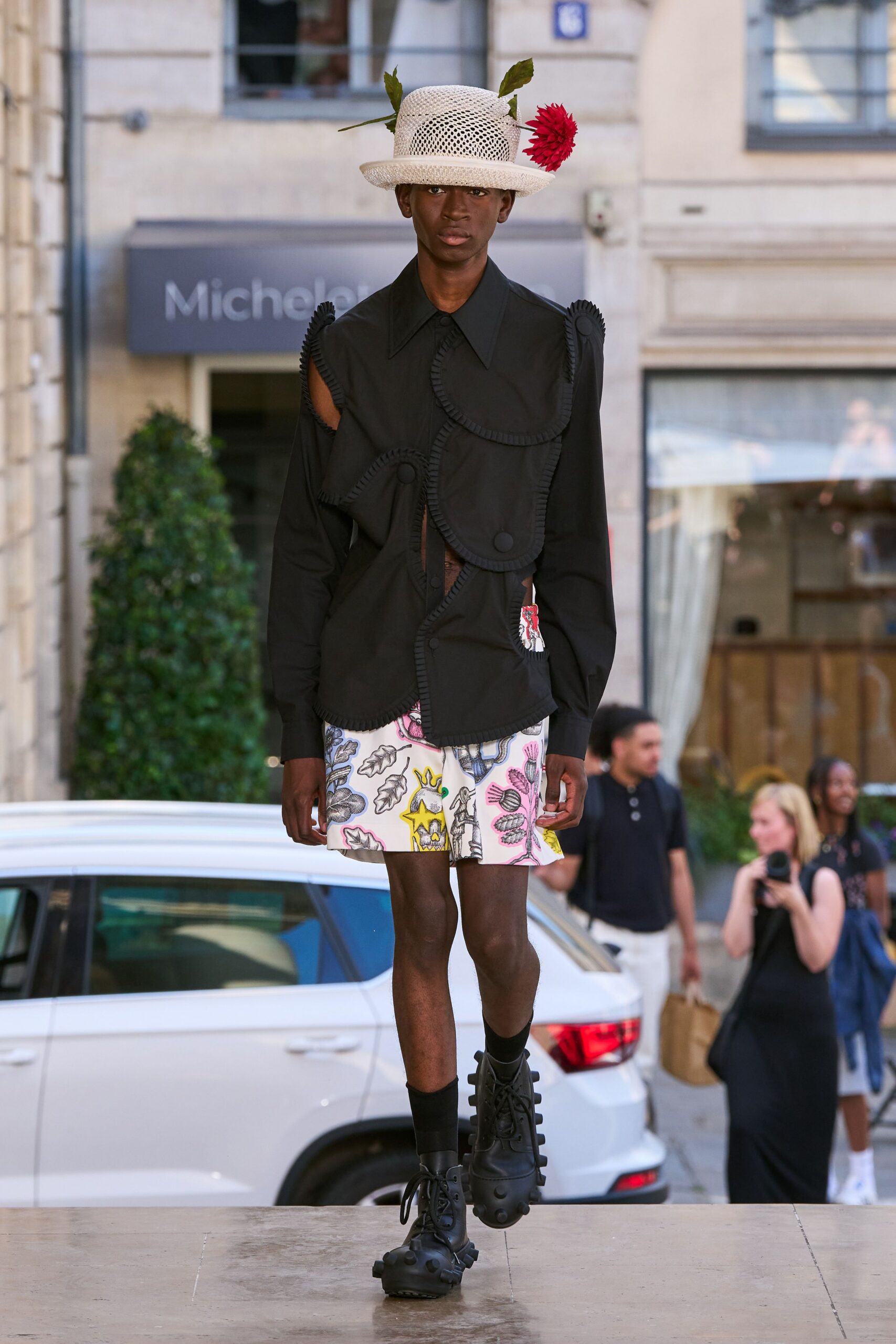 black shirt with printed shorts