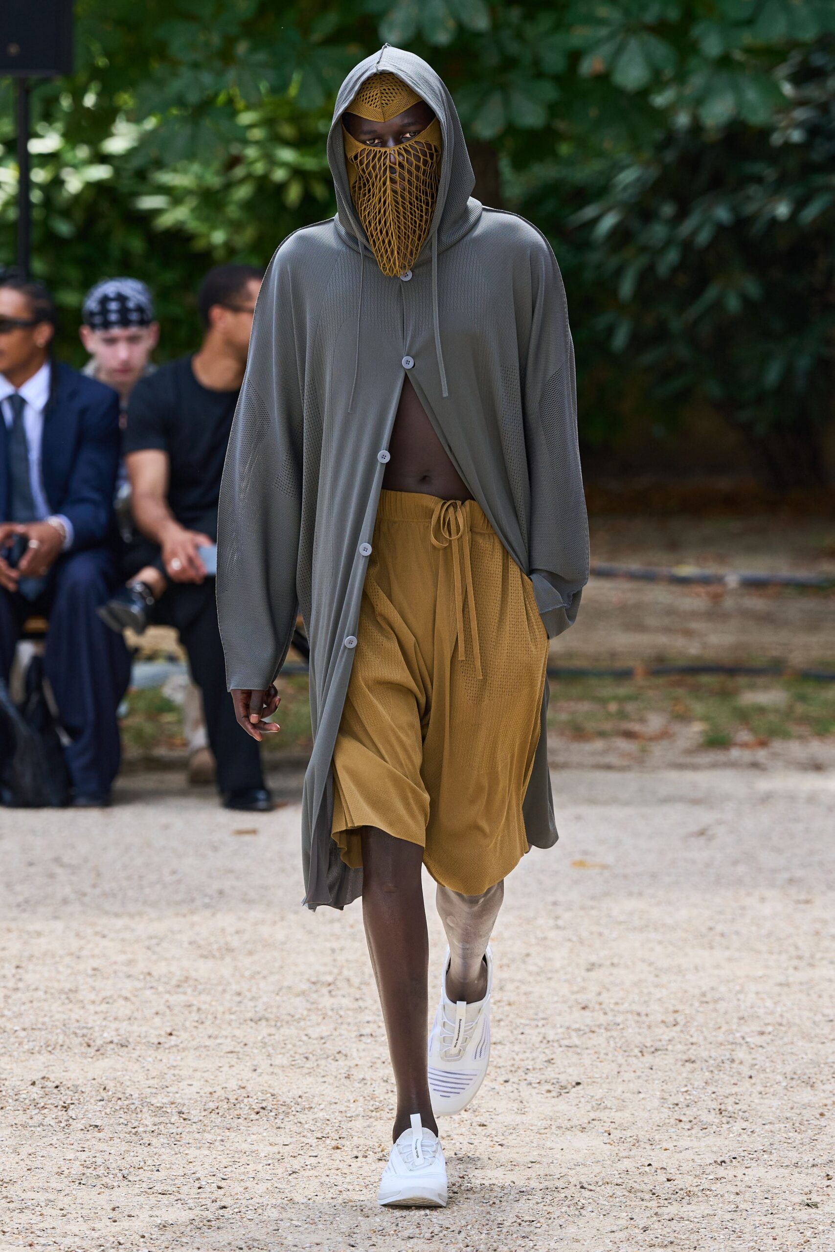 gray relaxed coat with brown shorts