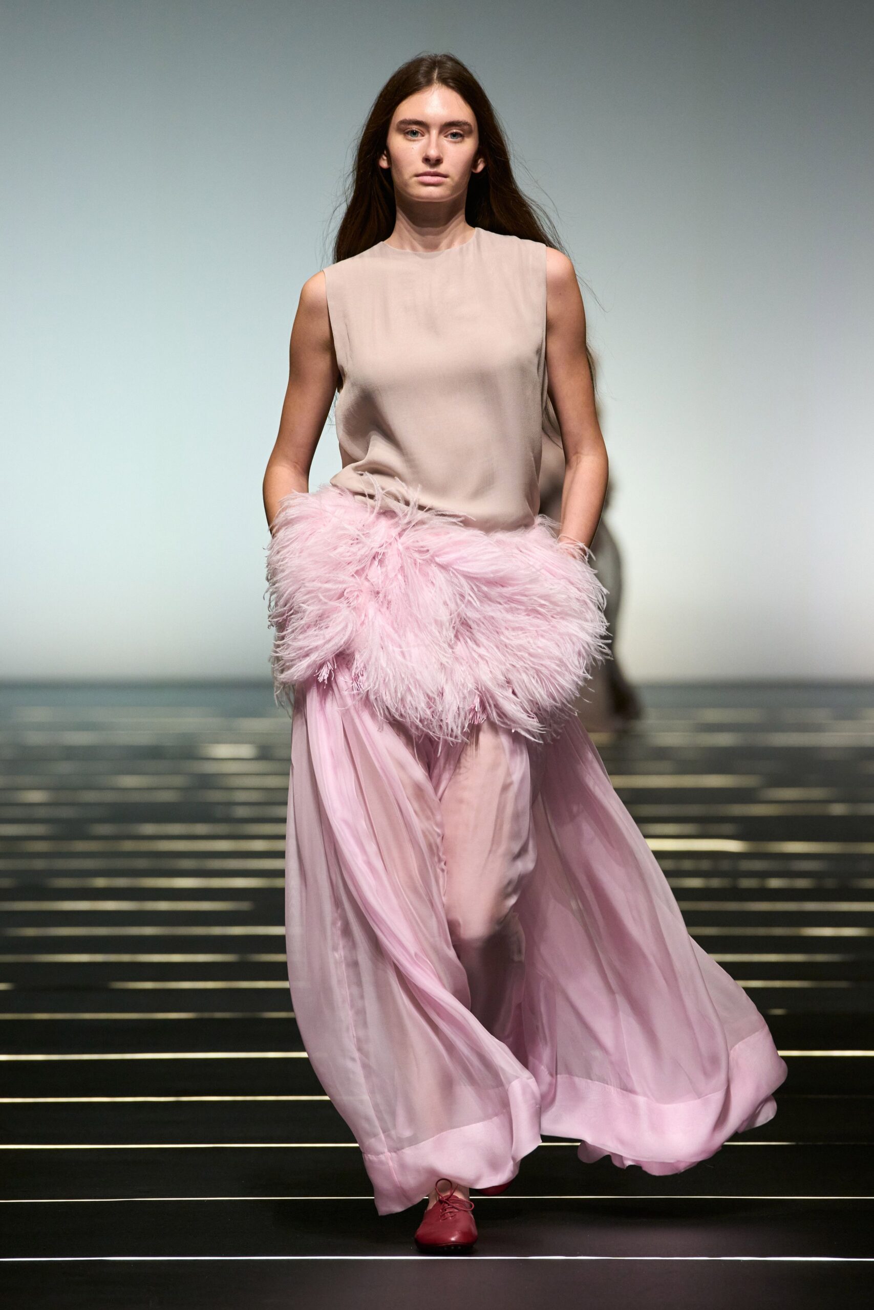 beige silk sleeveless top with pink layered skirt