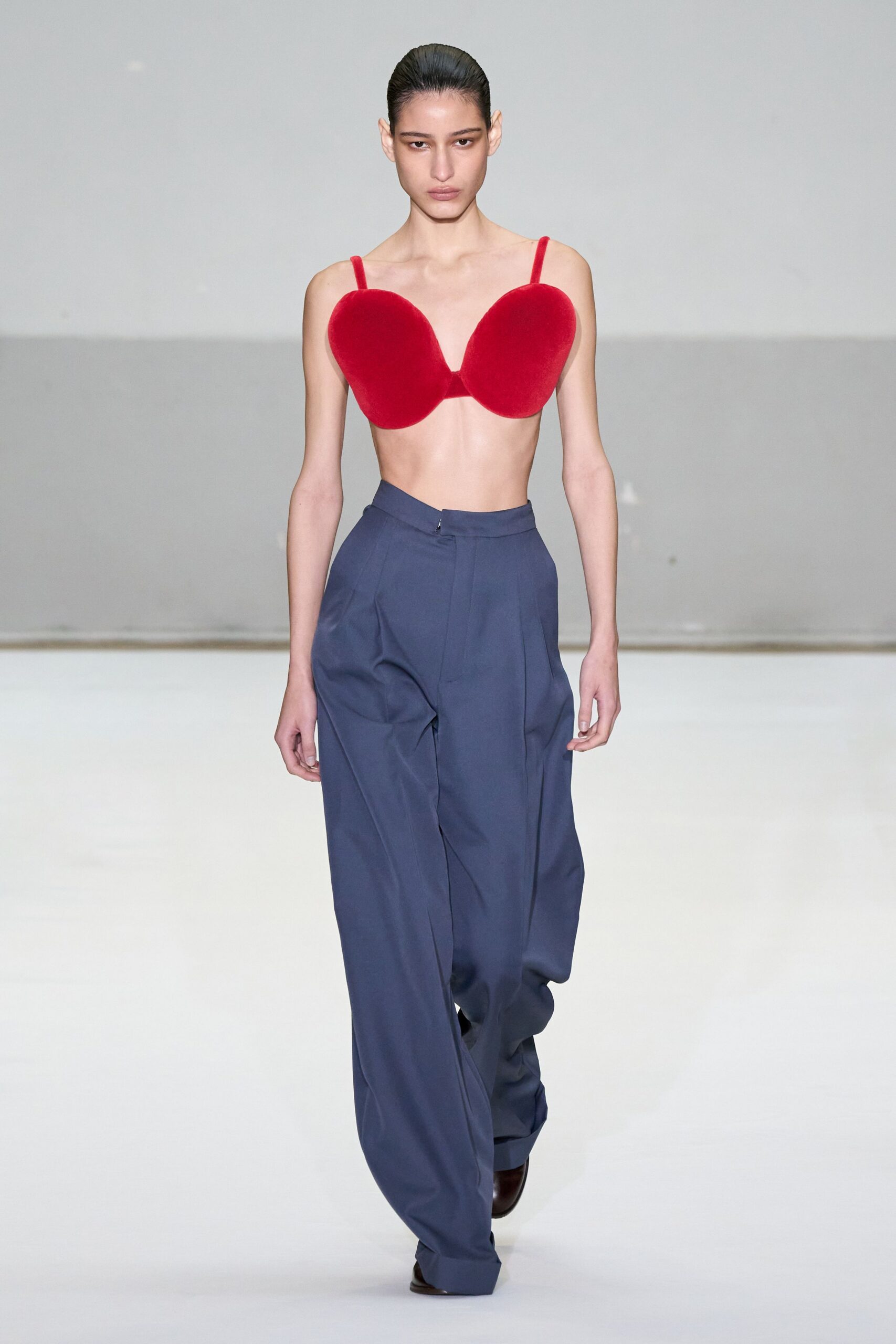 red velvet fitted top and blue relaxed pants