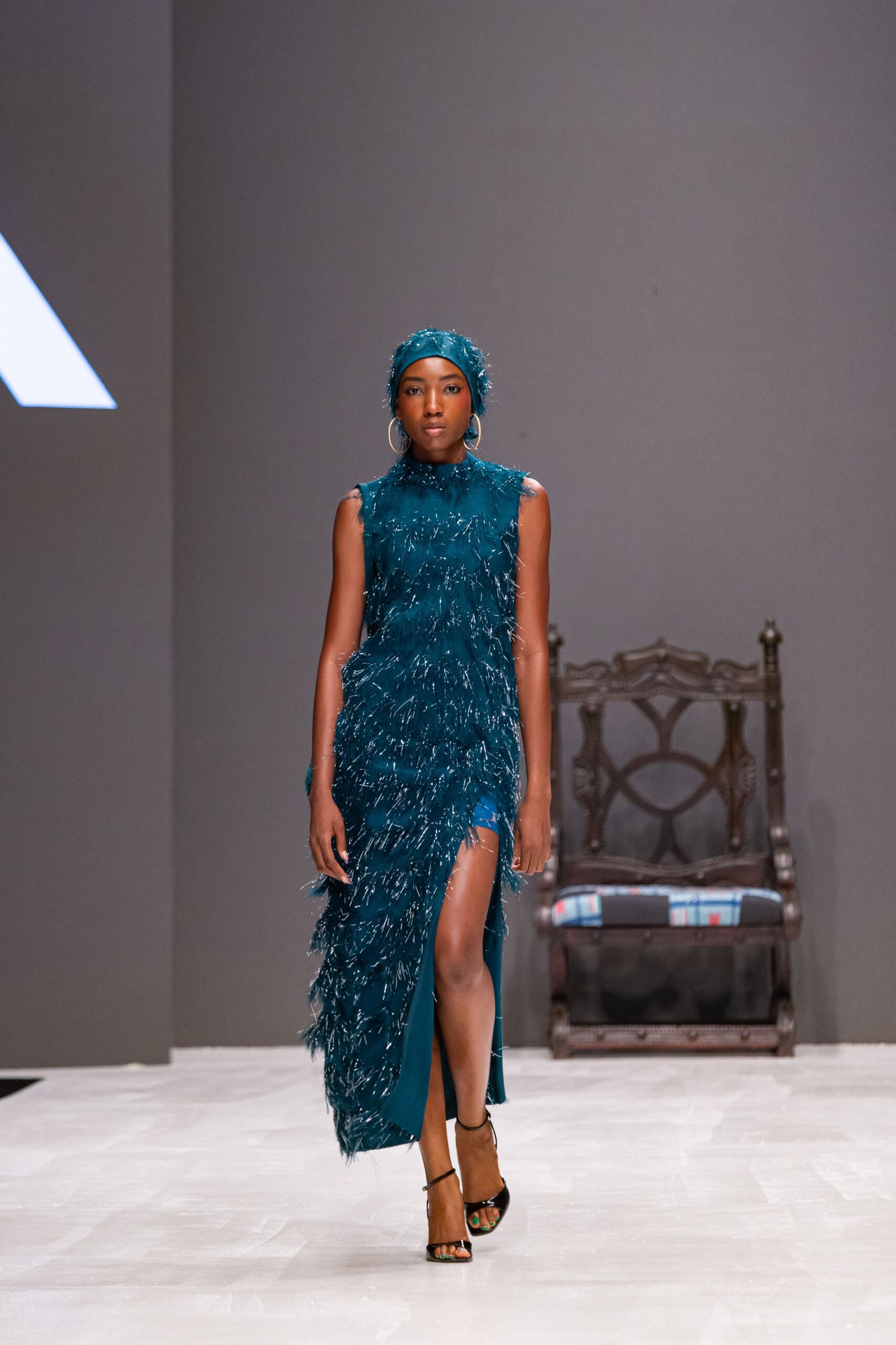 teal silk sleeveless high-neck fitted fringed flowing dress