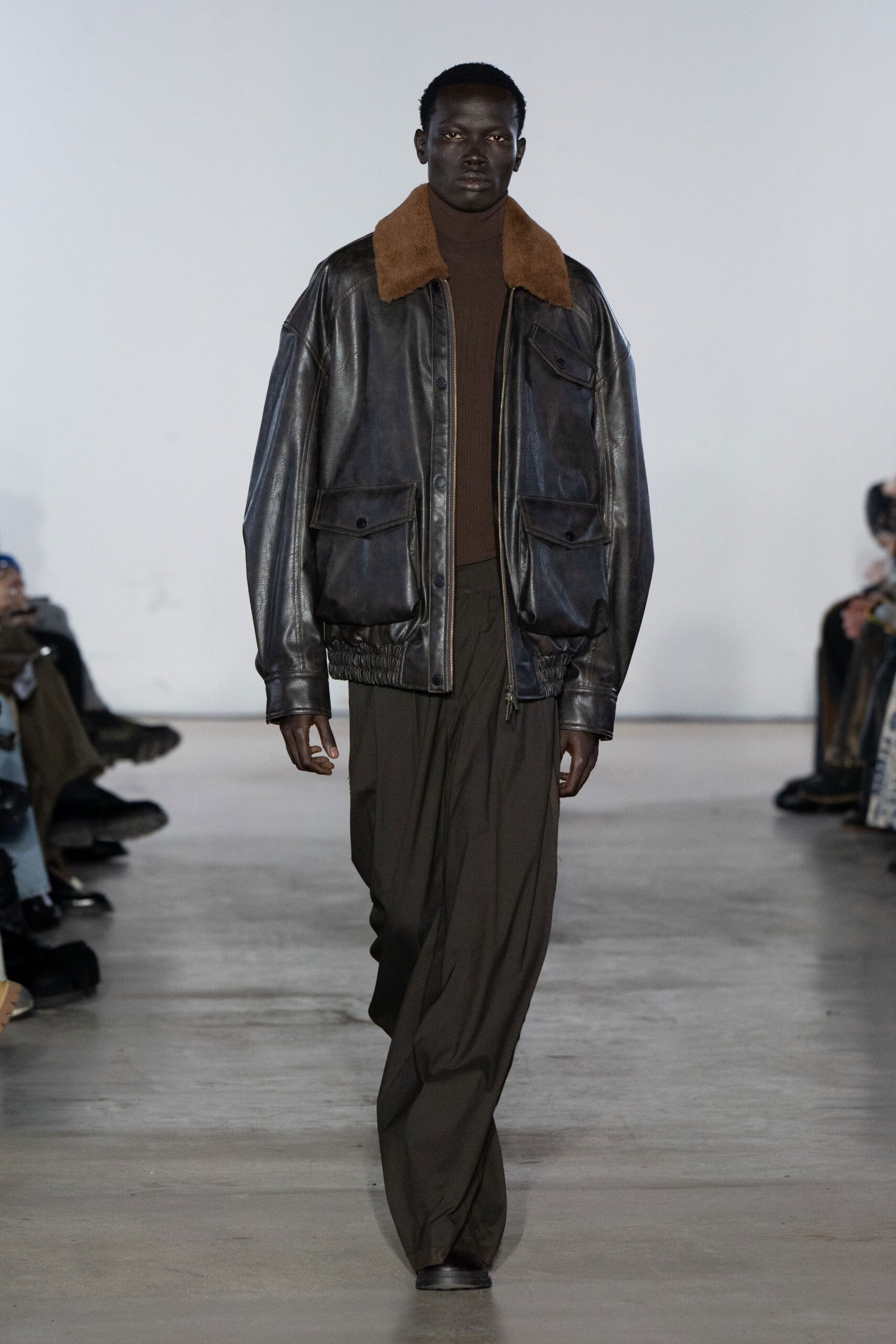 black leather jacket with brown top