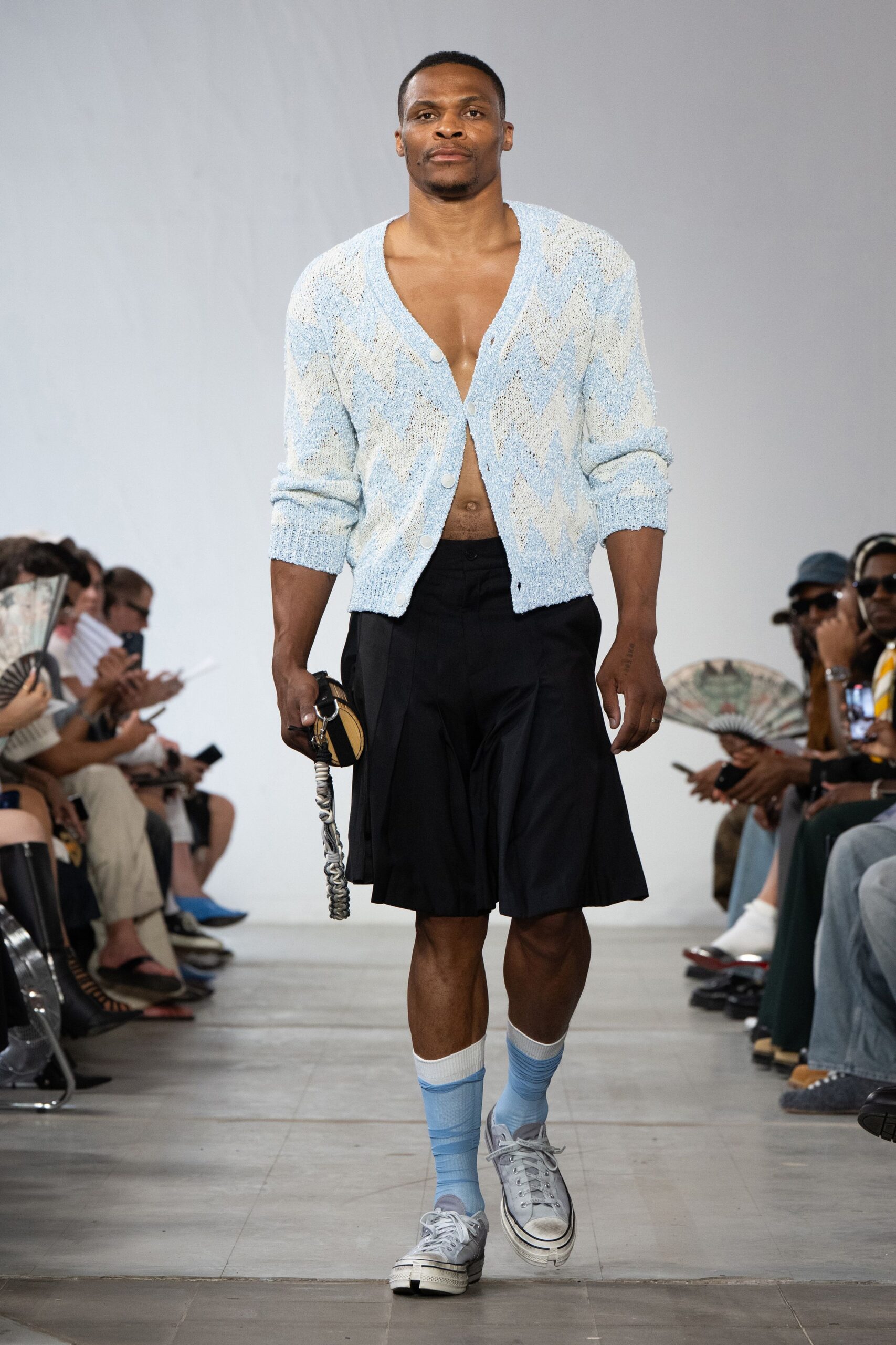 blue cardigan black shorts