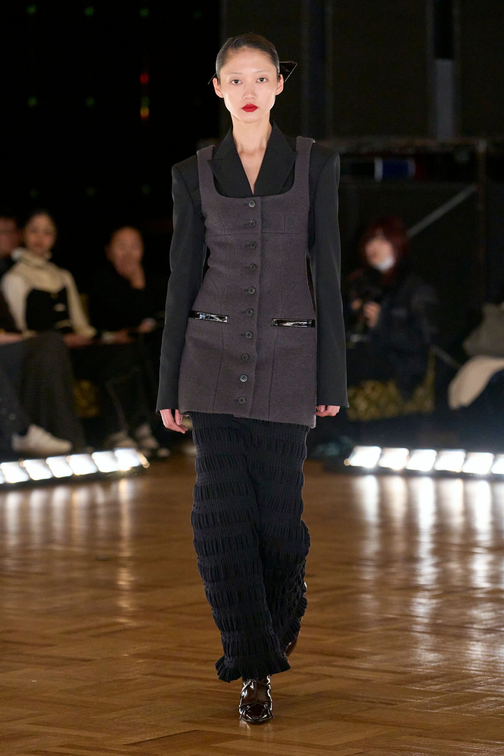 black tailored blazer with pleated pants