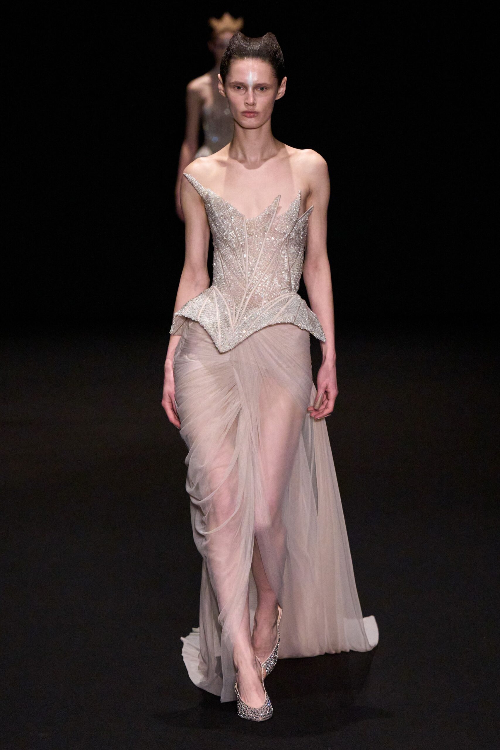 beige embellished gown with silver shoes