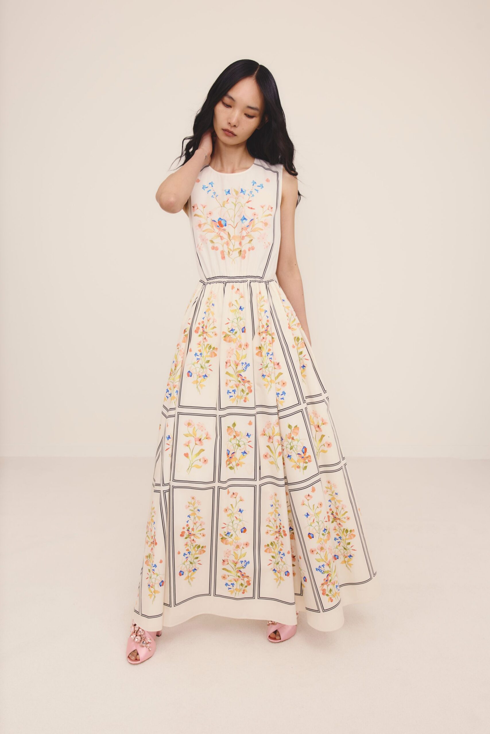 white cotton sleeveless high-neck fitted pleated embroidered gown
