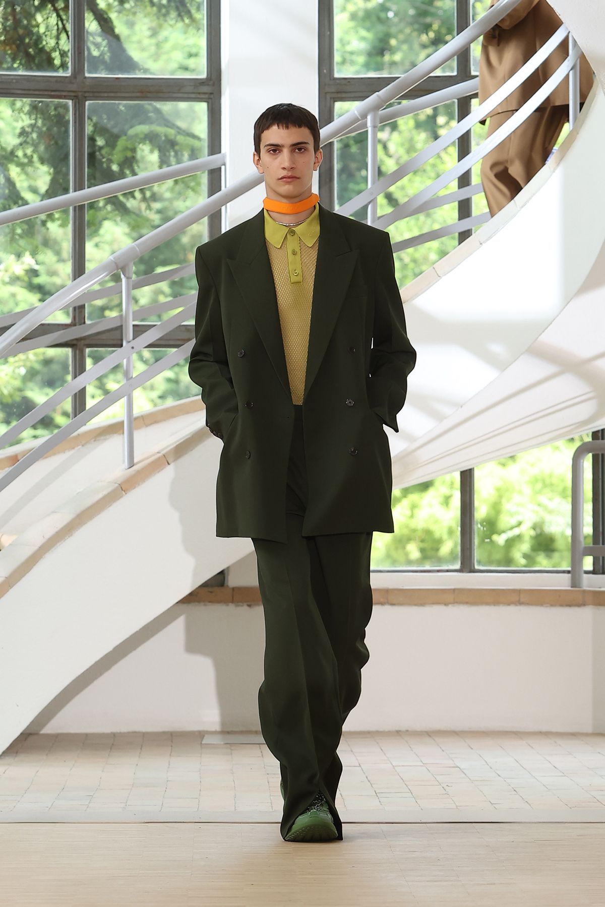 green tailored suit with yellow shirt