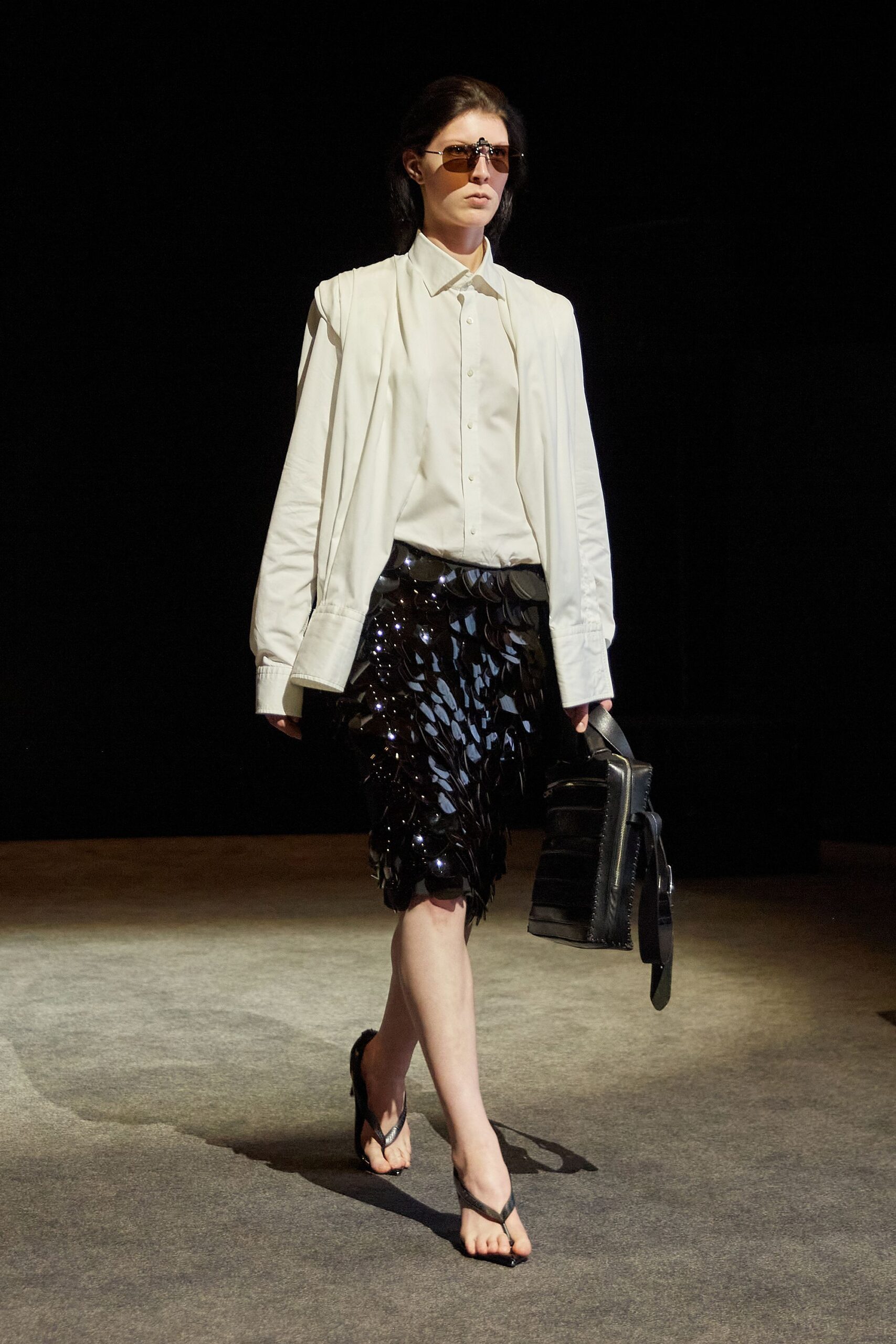 white jacket black pleated skirt