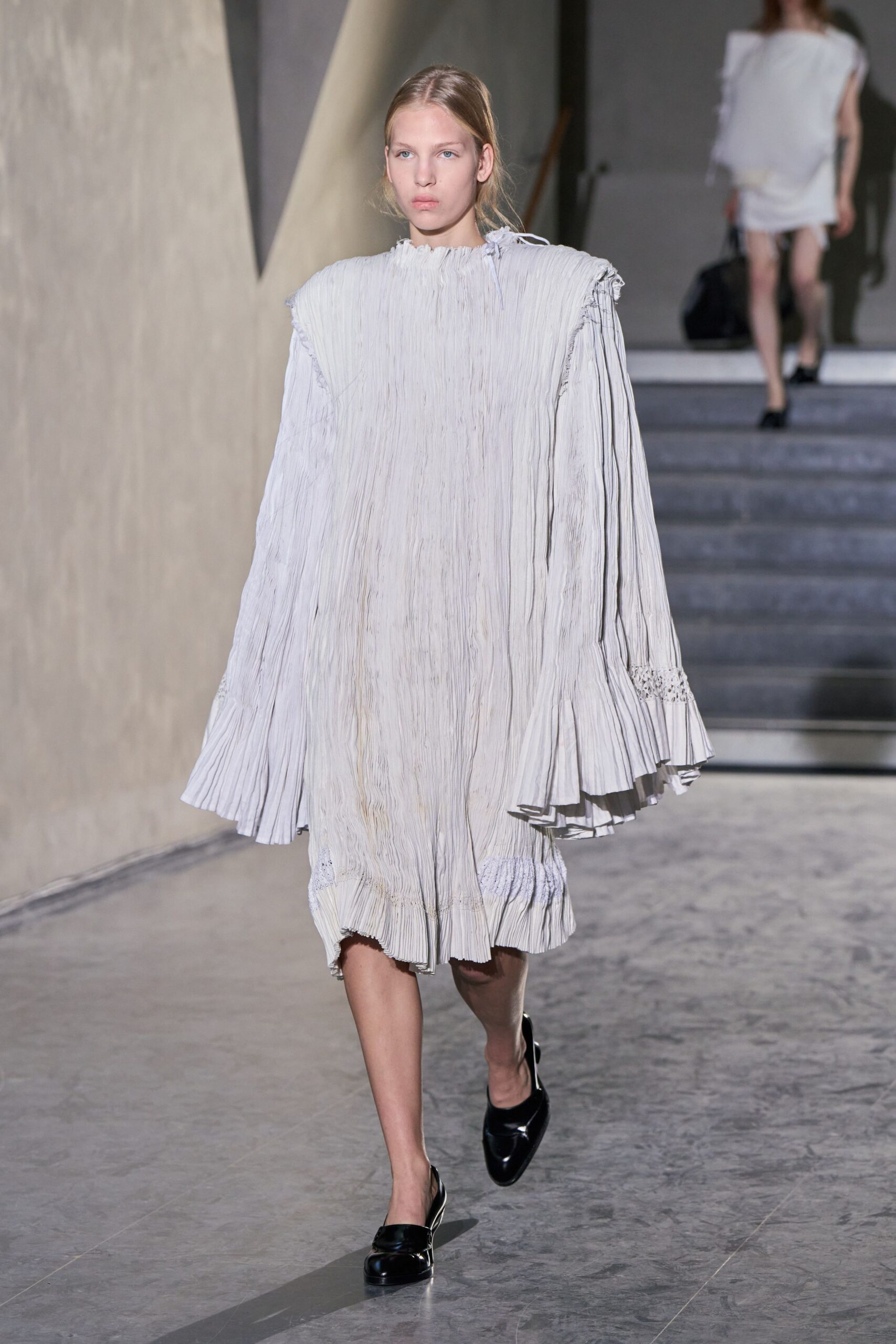 white pleated midi dress with black shoes