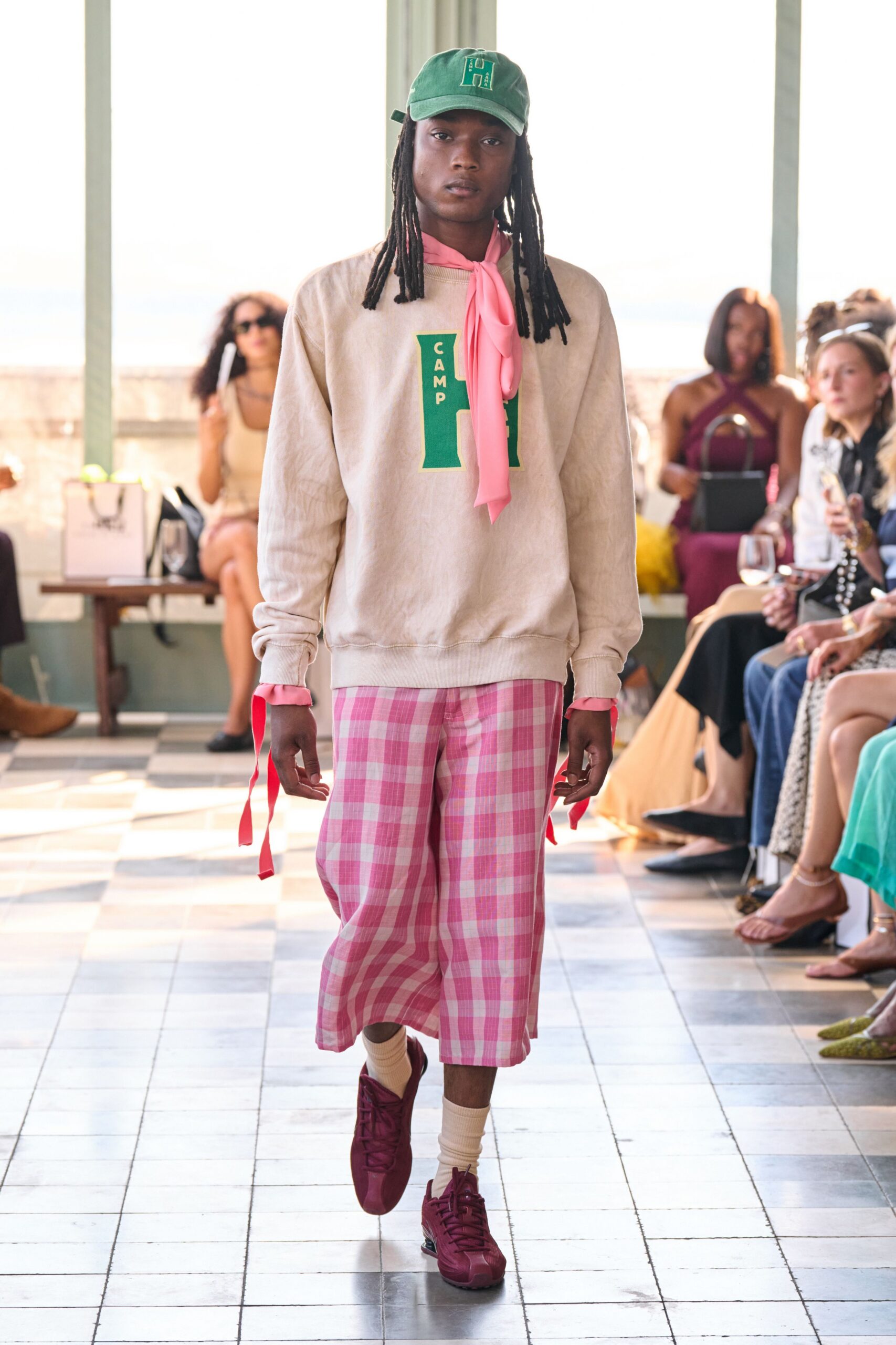 beige relaxed sweater with pink checked pants