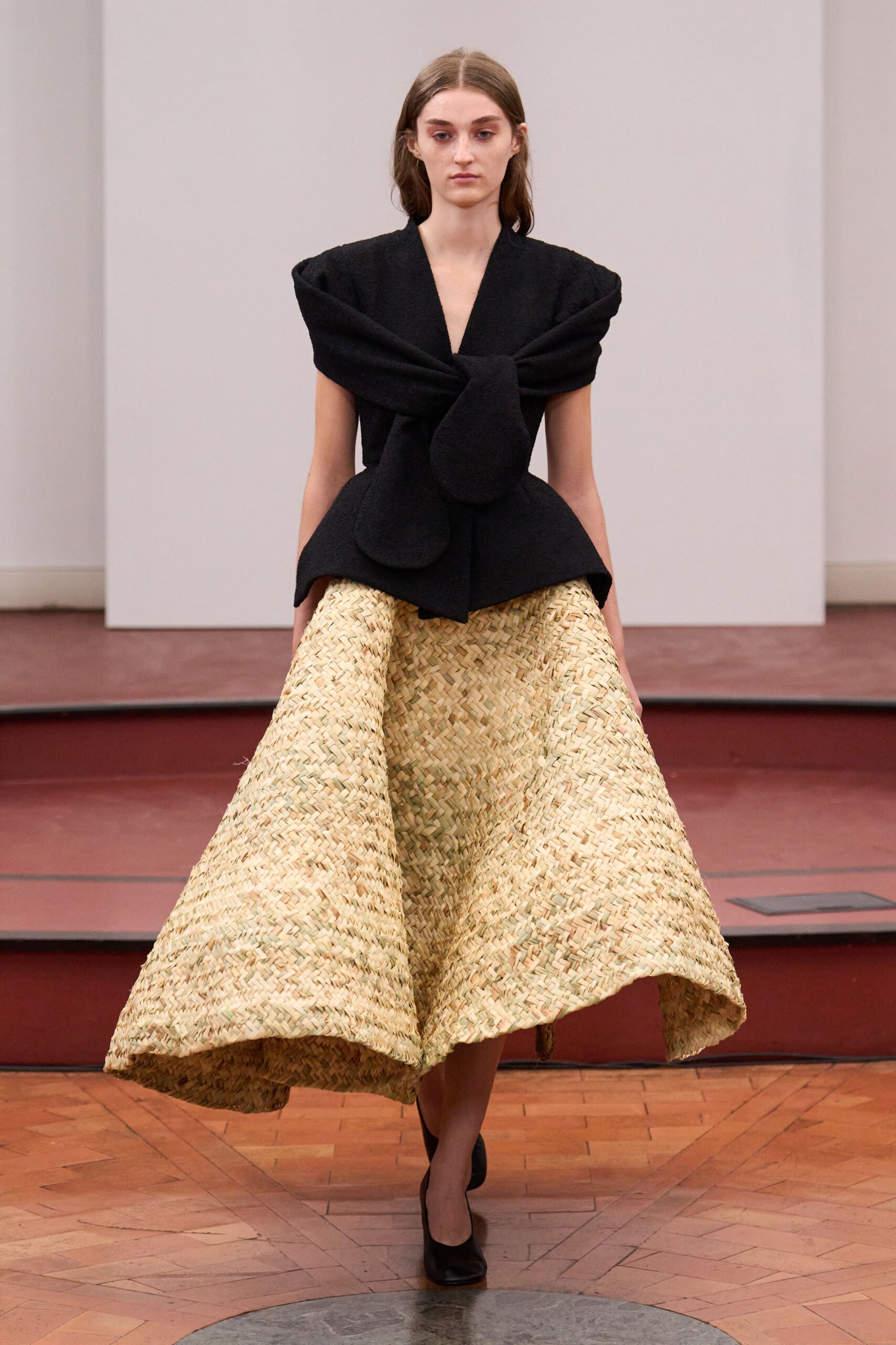 black fitted top beige flared skirt