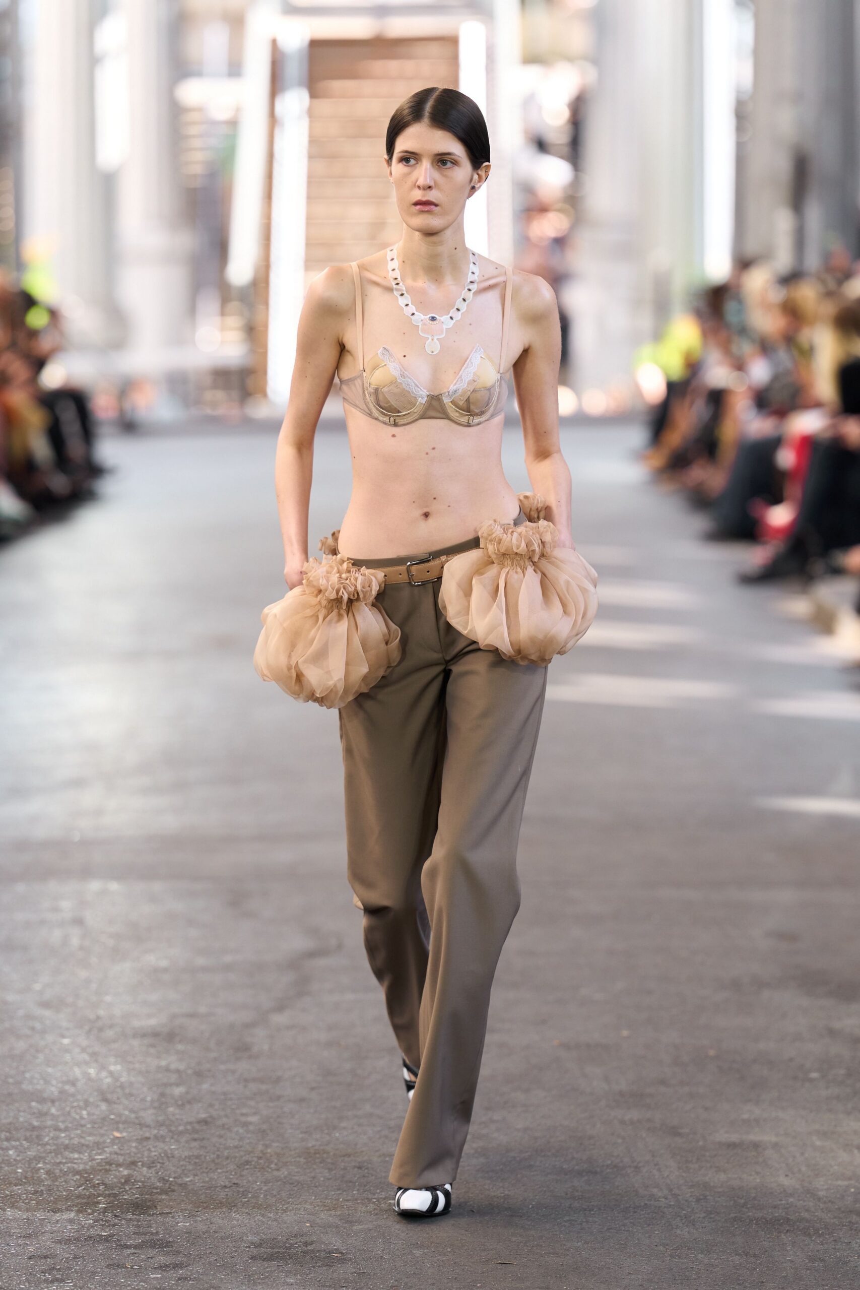 beige silk sleeveless top with brown pants