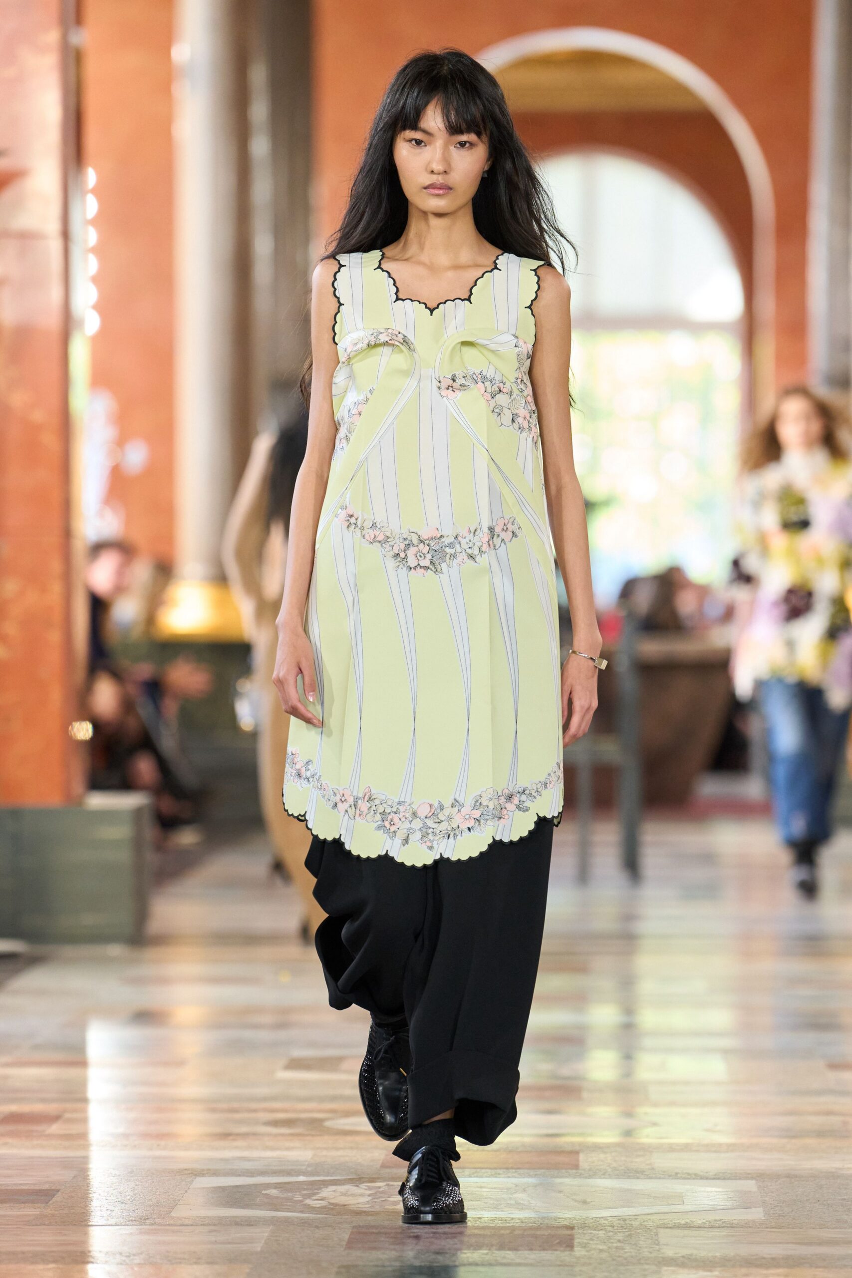 yellow embroidered midi dress with black pants