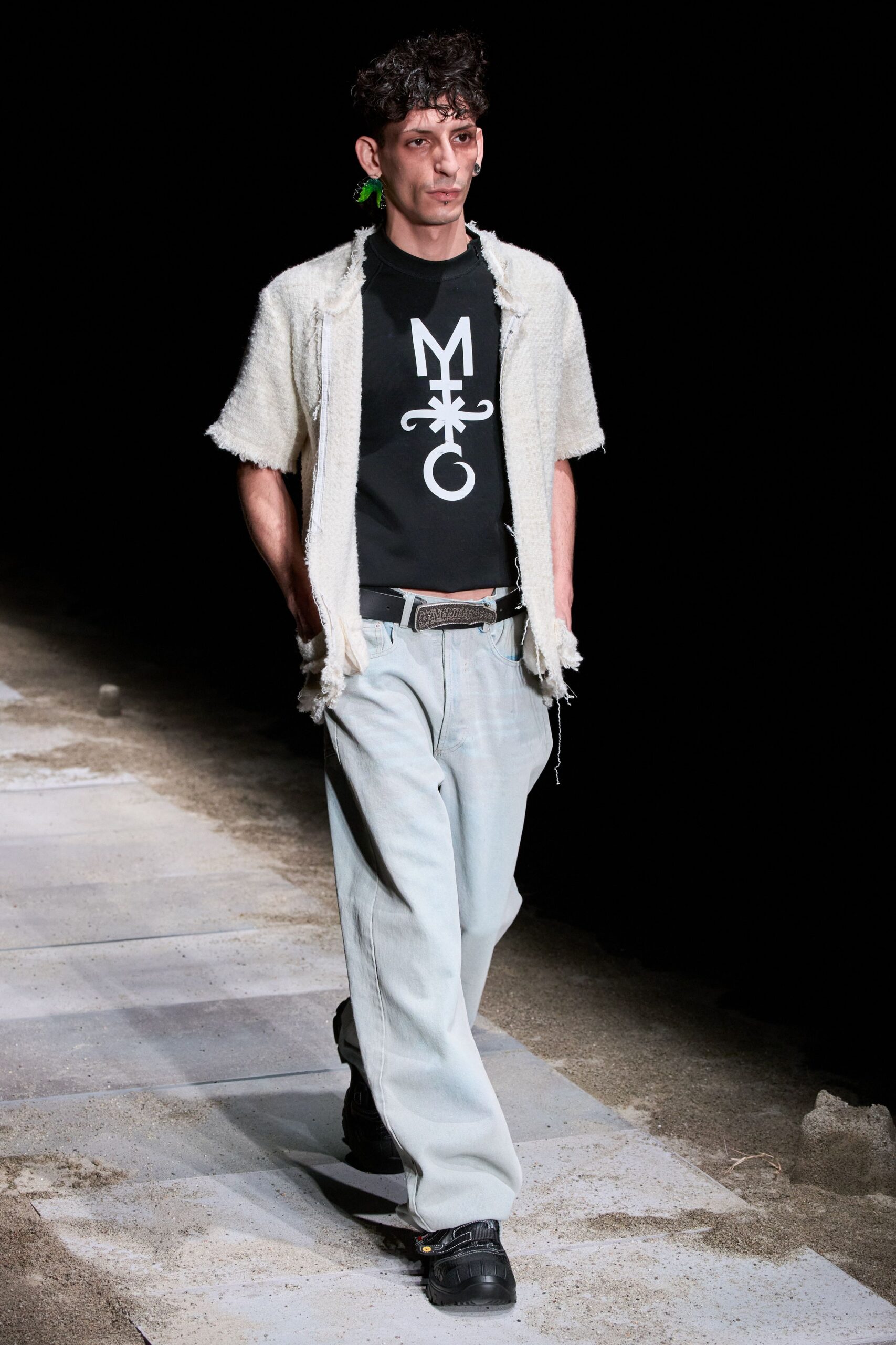 white fringed shirt black t-shirt gray pants