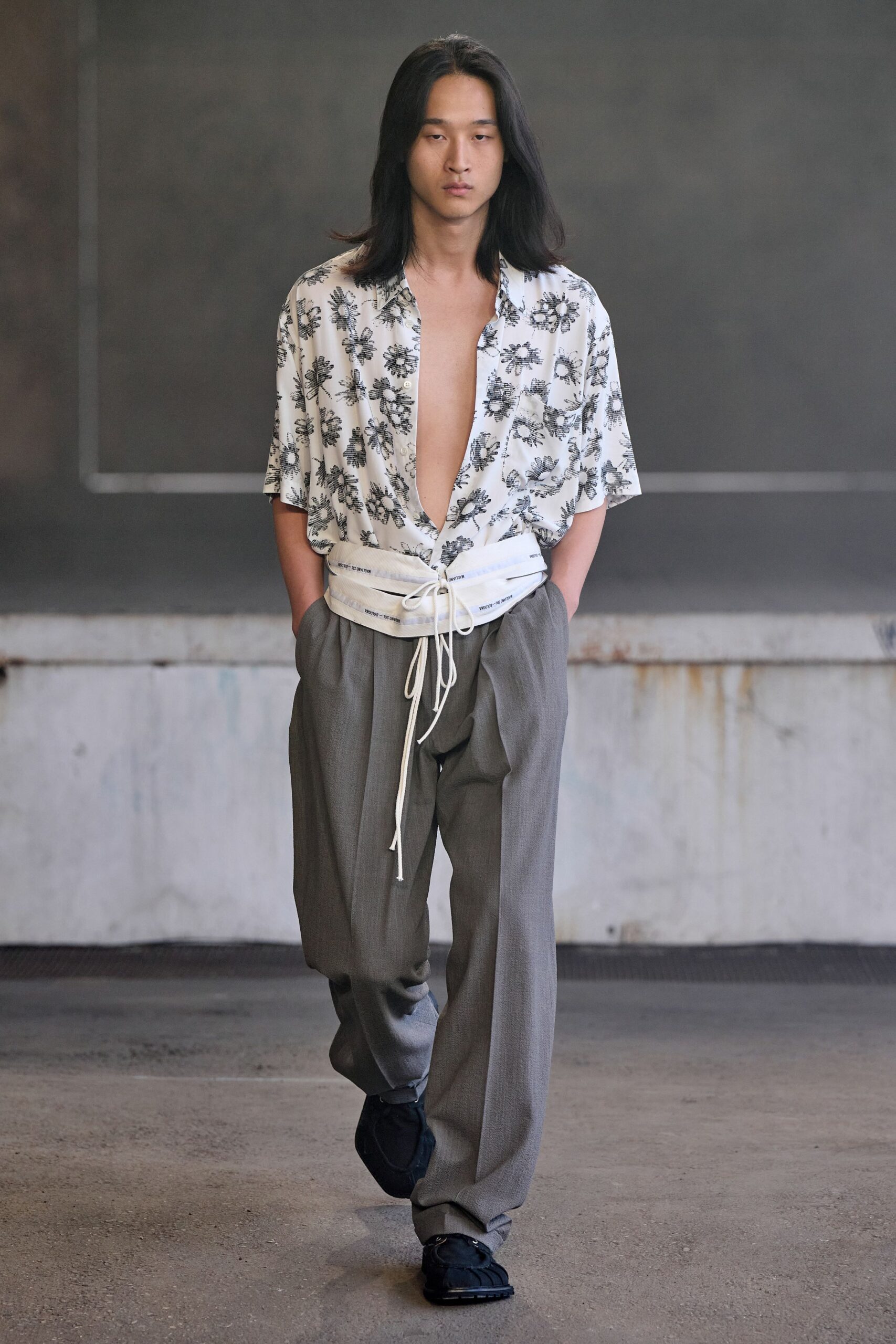 relaxed white printed shirt with tailored gray pants
